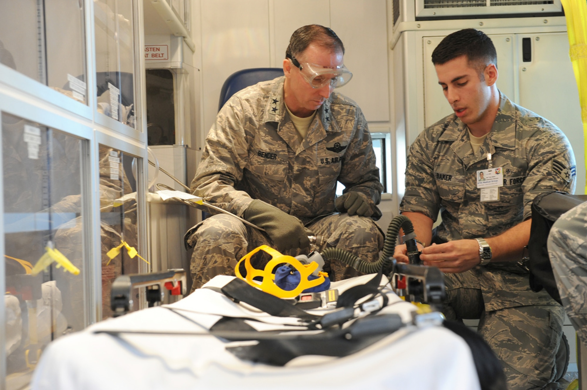 Senior Airman Tyler Baker, 87th Medical Operations Squadron aerospace medical technician, shows Maj. Gen. Bill J. Bender, USAF Expeditionary Center commander, the tools of his trade Feb. 7 here. Bender received an in-depth look into what the 87th Air Base Wing does and experienced firsthand what the talented men and women of this wing accomplish. (U.S. Air Force photo by Russ Meseroll/Released)
