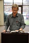 Tommy Hays reads an excerpt from his book “The Pleasure Was Mine” during a “Meet the Author” event at the base library on Seymour Johnson Air Force Base, N.C., Feb. 8, 2012. This book is currently the Wayne County Reads book of the month. (U.S. Air Force photo/Airman 1st Class John Nieves Camacho/Released)