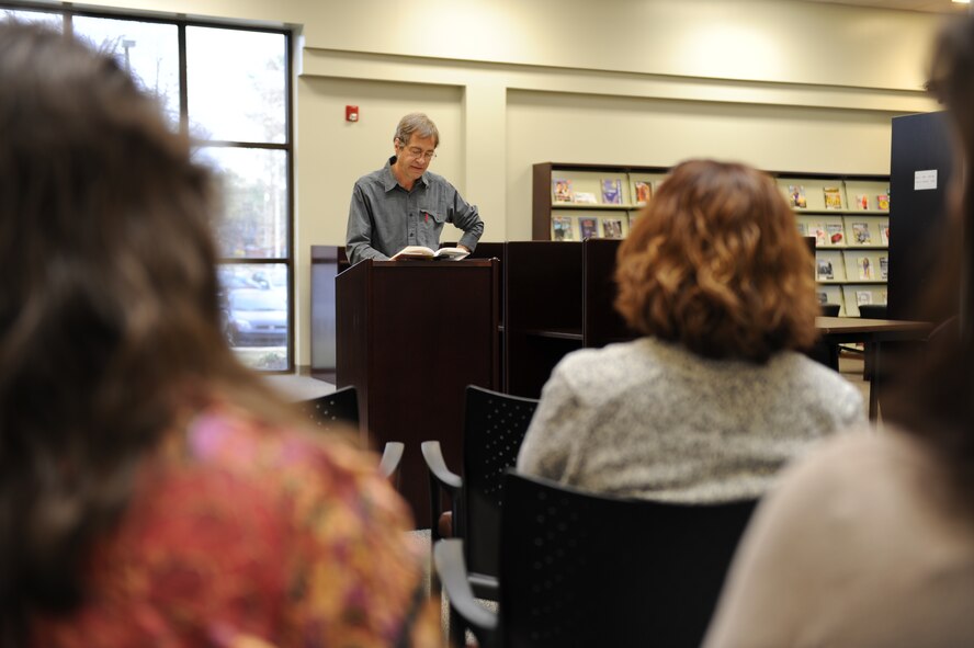 Tommy Hays reads an excerpt from his book “The Pleasure Was Mine” at the base library on Seymour Johnson Air Force Base, N.C., Feb. 8, 2012. The book is about a man who puts his wife in a nursing home and the impact it has on his relationship with his son and grandson. (U.S. Air Force photo/Staff Sgt. Courtney Richardson/Released)