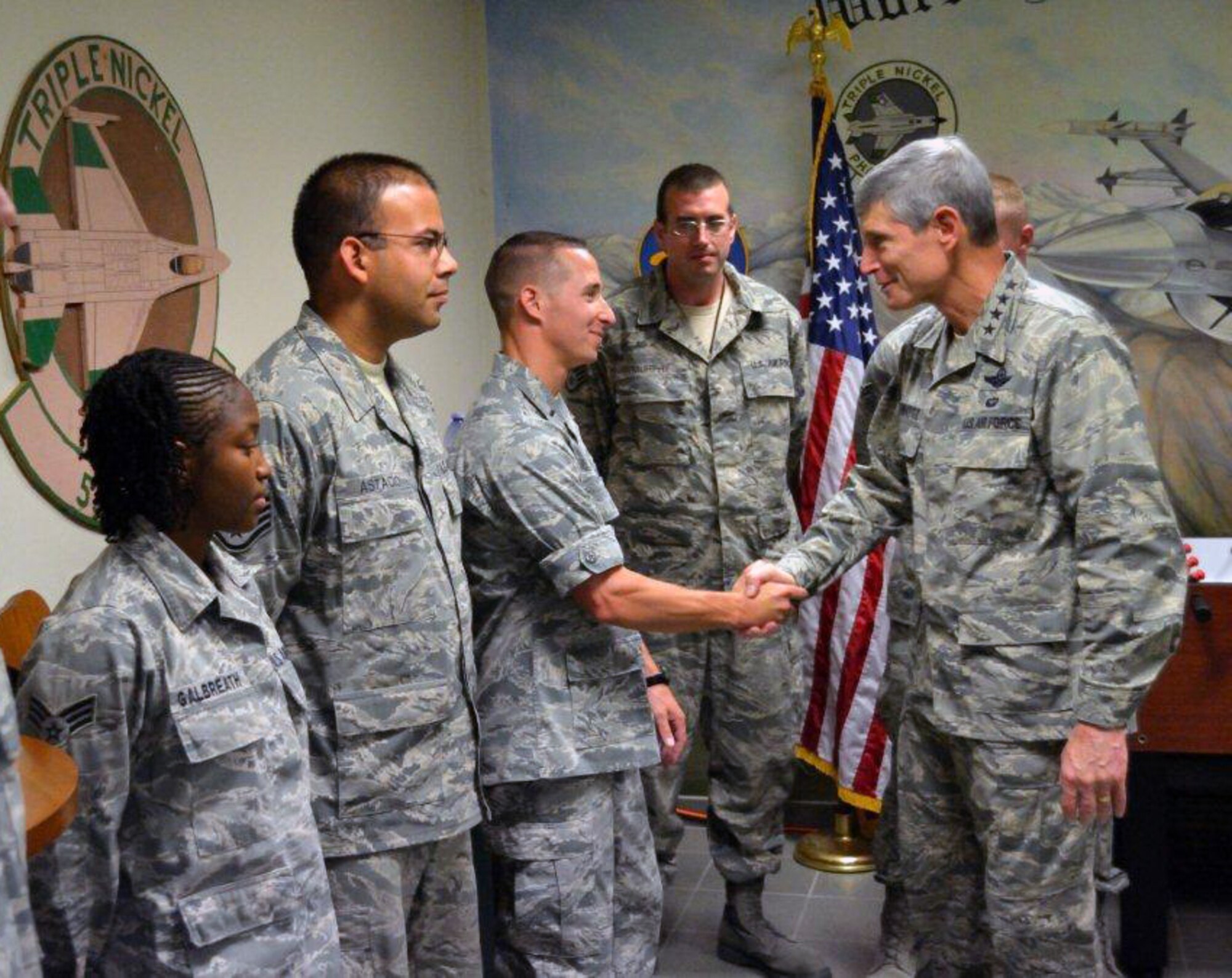 U.S. Air Force Chief of Staff Gen. Norton A. Schwartz shakes the hand of 1st Lt. Matthew Larson, 77th “Gambler” Aircraft Maintenance Unit officer in charge, at Aviano Air Base, Italy, to congratulate the “Gamblers” on their excellent work during Operation Unified Protector. The 77th FS deployed to OUP to support NATO forces through the suppression and destruction of enemy air defenses and ensured the safety of NATO assets. (U.S. Air Force courtesy photo/released)