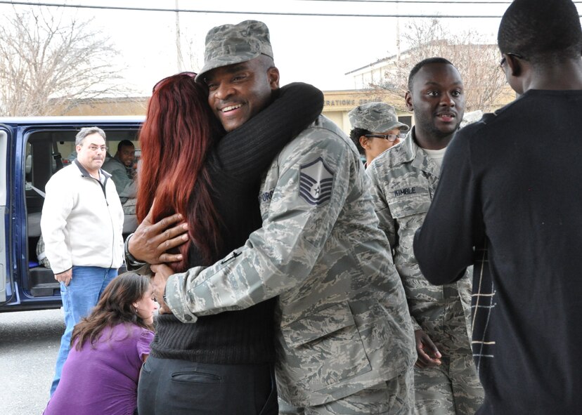 Master Sgt. Adolphus Grisby is welcomed back to Seymour Johnson by friends and family on Feb. 8, 2011. The 916th Air Refueling Wing will host a number of returning deployers this month. (USAF photo by MSgt. Wendy Lopedote, 916ARW/PA)