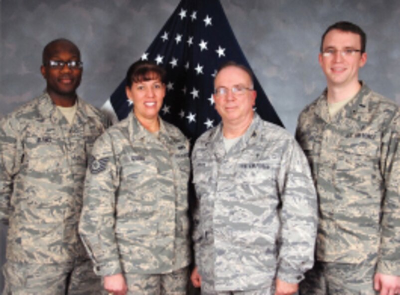 Staff Sgt. Derek Blanks, Tech. Sgt. Susanna Gyger, Chaplain Col. Les Hyder and Chaplain 1st Lt. Paul Snyder pose for a group photo during a site visit here on Jan. 20, 2012.