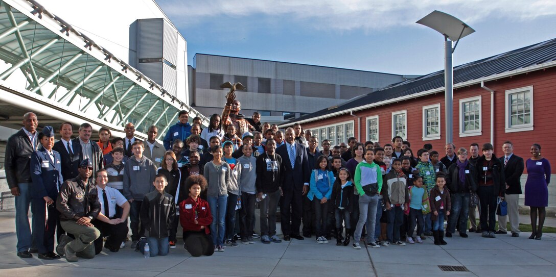SEATTLE- Both adults and youth who participated in the Keep the Dream Alive event through the Lt. Col. Michael P. Anderson Aerospace Program, stand in front of the memorial at the Seattle Museum of Flight, Feb. 4, 2012. One of the activities of the event was the Reaching your Potential Panel which 446th Airlift Wing Reserve pilots, Lt. Col. Ron Limes and Lt. Col. Kim Scott participated in, along with other guests. The purpose of the even was to give youth inspiration and opportunities to achieve their goals. (photo courtesy of Seattle Museum of Flight)