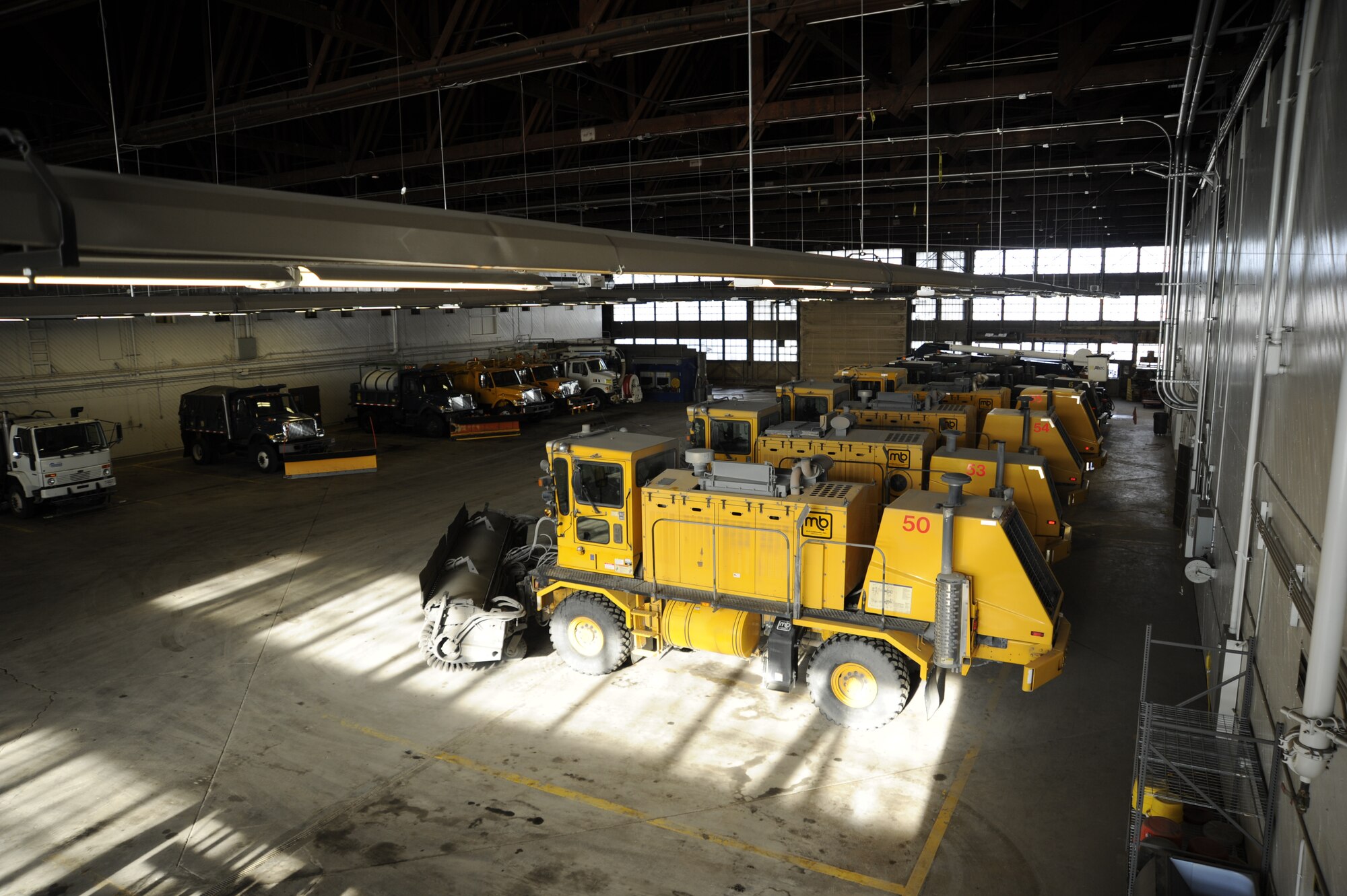 Snowplows parked in the snow barn just off the flight line at Fairchild Feb. 6.  These snowplows clear the runway and taxiways for aircraft when snow accumilation makes it dangerous for airfield operations. (U.S. Air Force photo by Airman 1st Class Ryan Zeski)