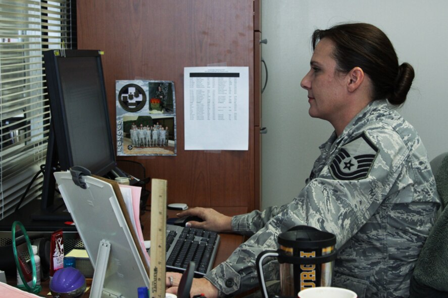 Master Sgt. Dawn Kursel, attached to the 911th Aeromedical Staging Squadron, organizes folders and files at the medical records office, Feb. 9, 2012. Master Sgt. Kursel is in charge of both updating and maintaining these records in support of sustaining the Airmen’s physical and mental health status, which also provides health readiness for a rapidly deployable force. (U.S. Air Force photo Tech. Sgt. Ralph Van Houtem/Released)