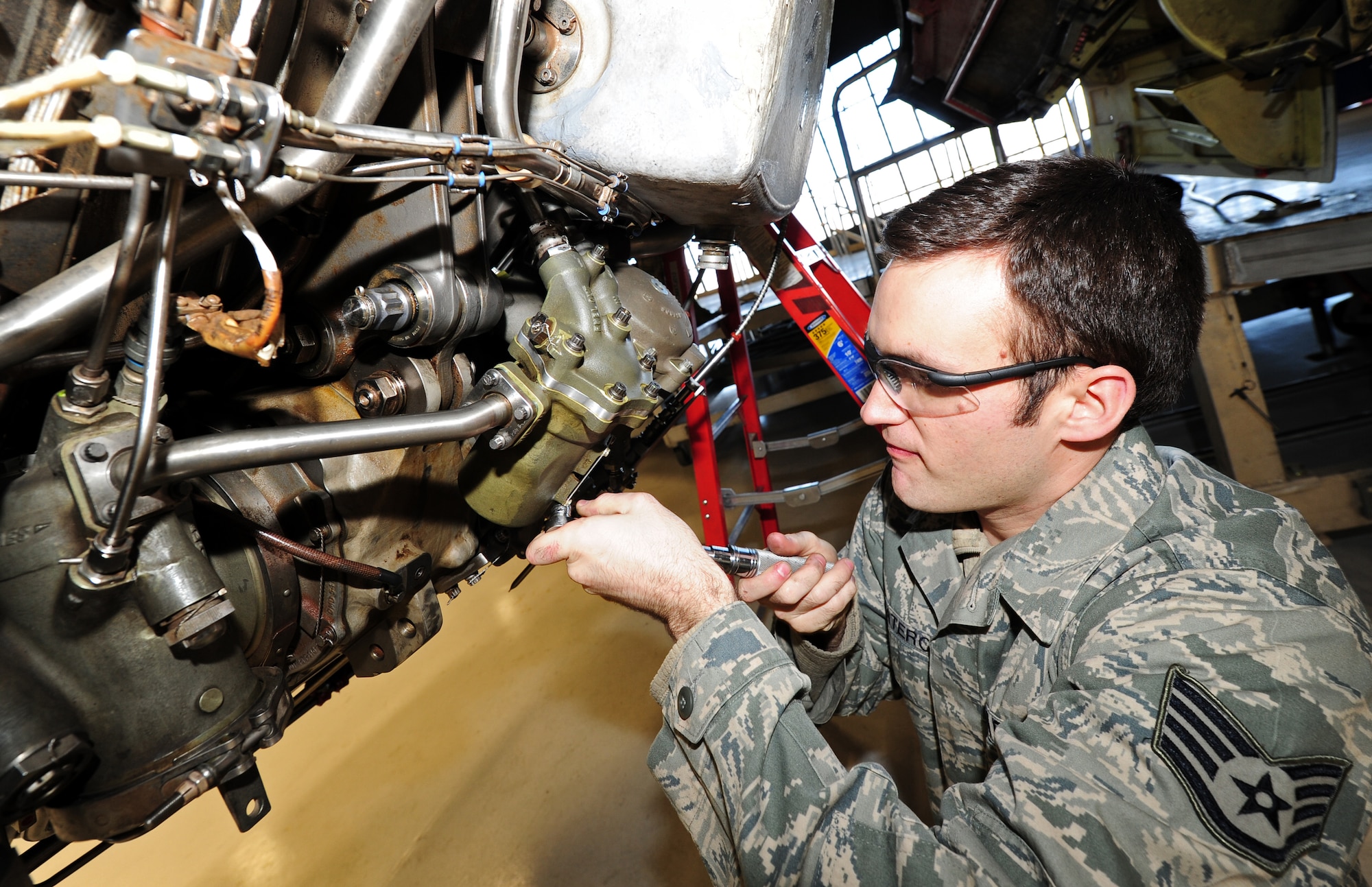 Staff Sgt. John Matero maintains the servo fuel heater and fuel heat exchanger at Fairchild Jan. 25. KC-135s provide the core aerial refueling capability for the Air Force and have excelled in this role for more than 50 years. Air Mobility Command manages and inventory of more than 400 Stratotankers. (U.S. Air Force photos by Airman 1st Class Taylor Curry) 