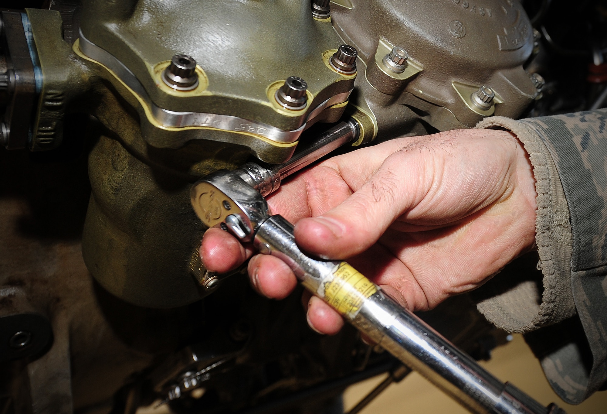 Staff Sgt. John Matero tightens a bolt on a servo fuel heater  at Fairchild Jan 25. (U.S. Air Force photos by Airman 1st Class Taylor Curry) 