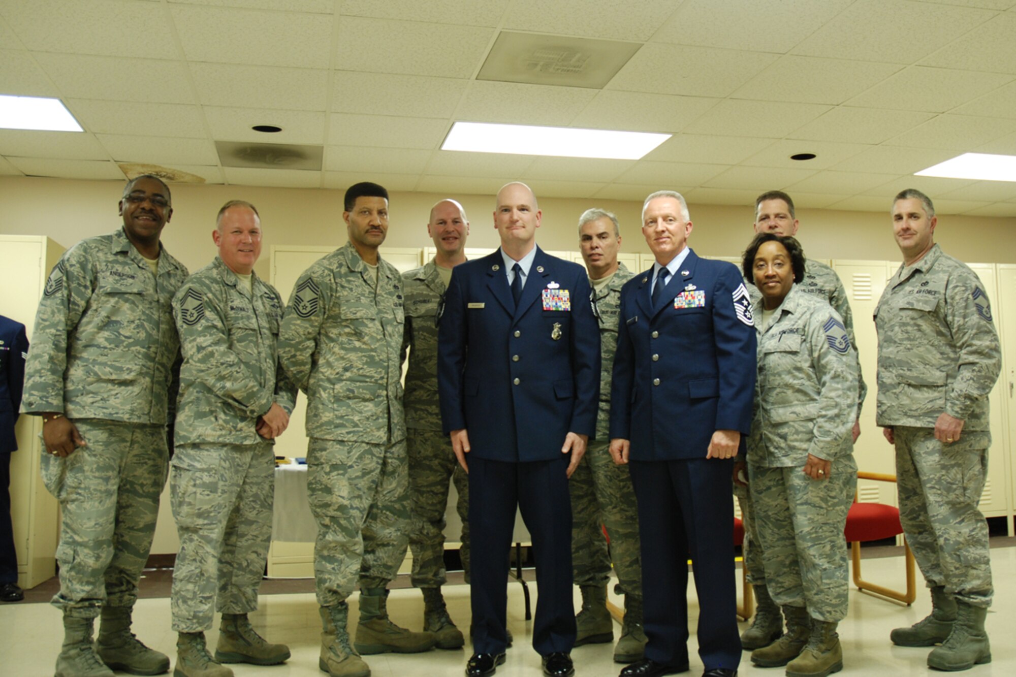 Dobbins chiefs congratulate Chief Master Sgt. DeMaine Milbach, 94 SFS manager, during a promotion and pin-on ceremony Feb. 4, at the base firing range. Milbach is succeeding Chief Master Sgt. Wendell Peacock, former 94 SFS manager and current 94th Airlift Wing Command Chief Master Sgt. (U.S. Air Force photo/Senior Airman Spencer Gallien)