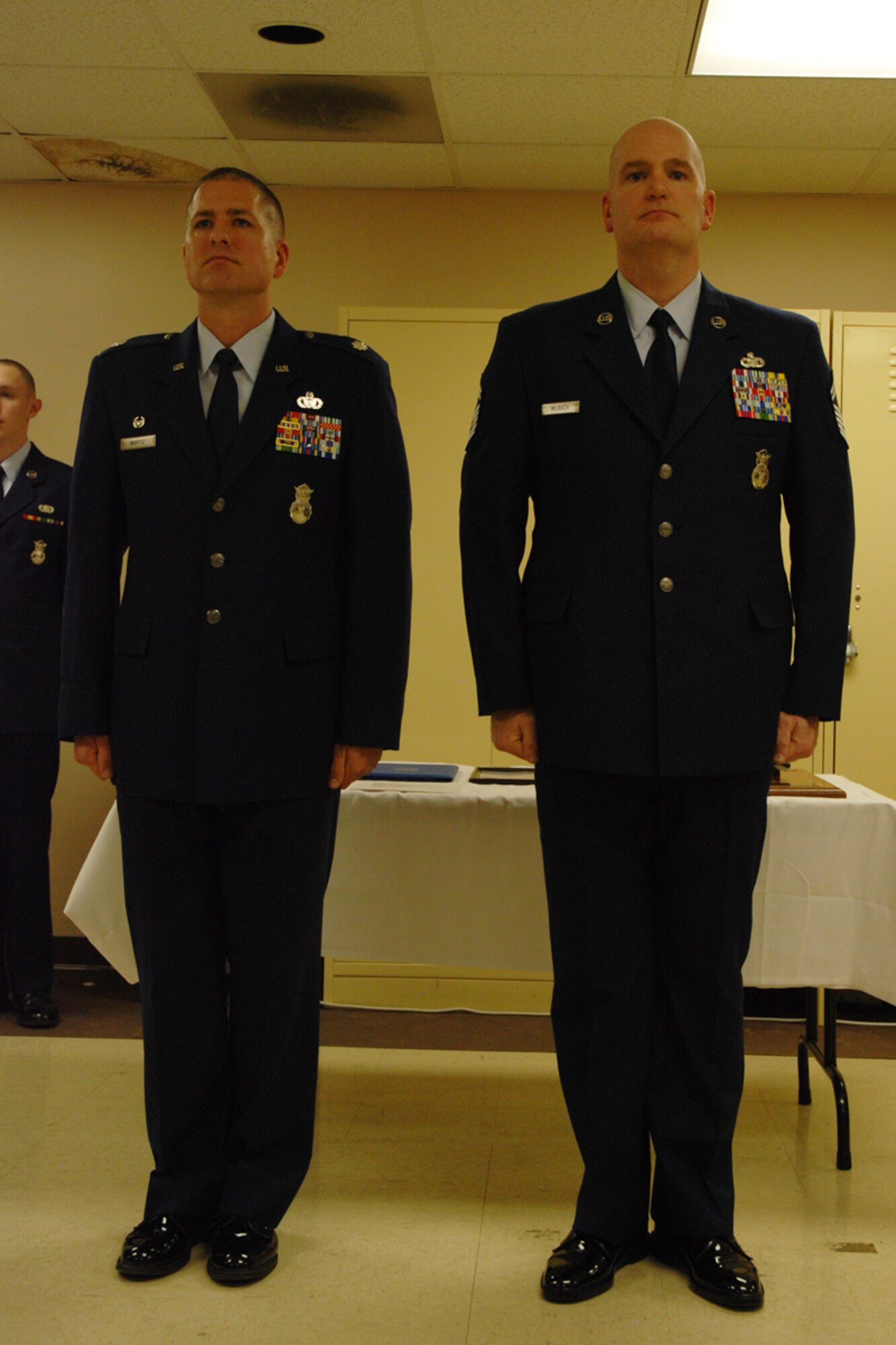 Lt. Col. Timothy Martz, 94th Security Forces Squadron commander, introduces Chief Master Sgt. DeMaine Milbach, 94 SFS manager, during his promotion and pin-on ceremony Feb. 4, at the base firing range. Milbach is succeeding Chief Master Sgt. Wendell Peacock, former 94 SFS manager and current 94th Airlift Wing Command Chief Master Sgt. (U.S. Air Force photo/Senior Airman Spencer Gallien)