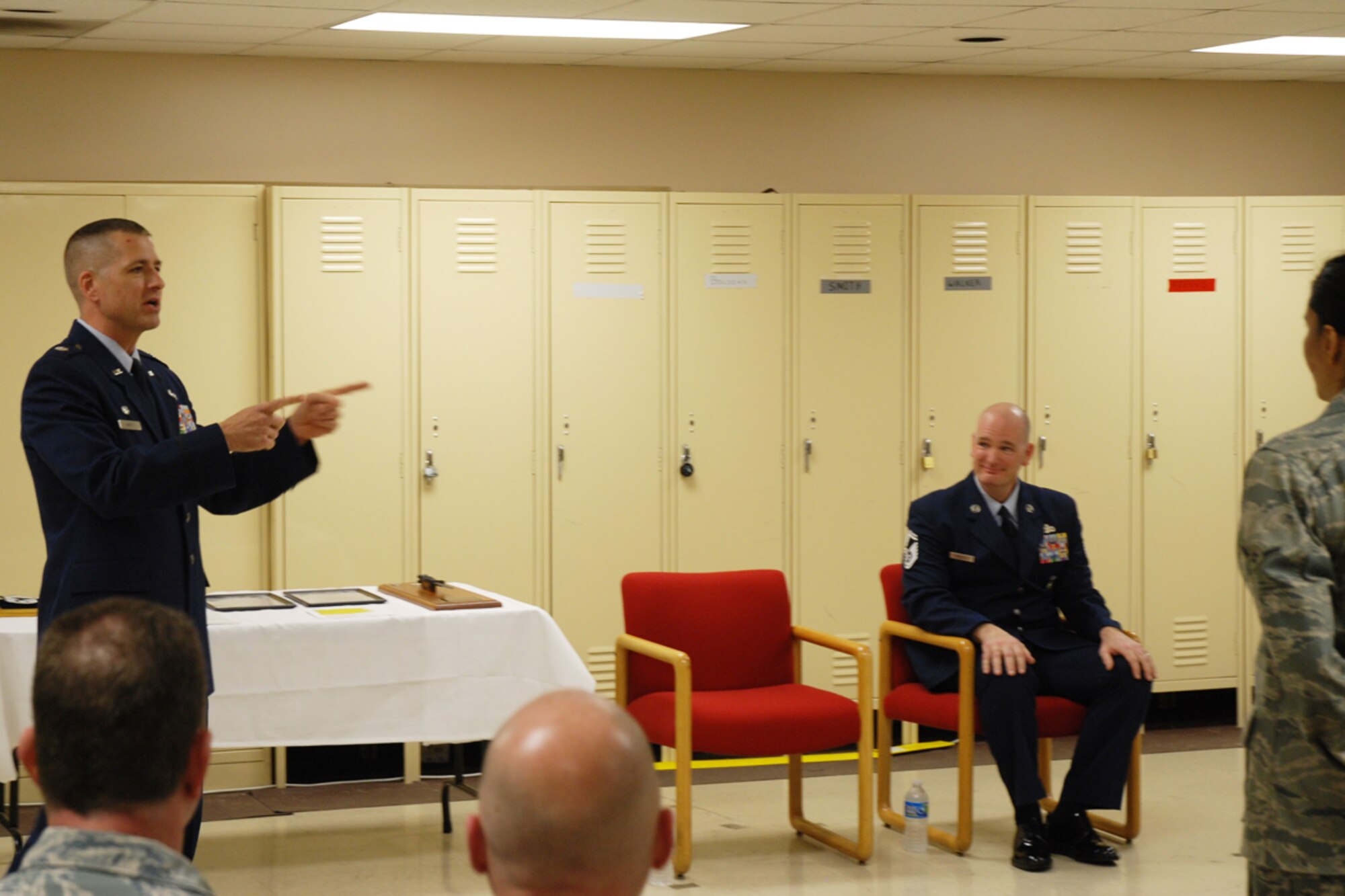 Lt. Col. Timothy Martz, 94th Security Forces Squadron commander, introduces Chief Master Sgt. DeMaine Milbach, 94 SFS manager, during a promotion and pin-on ceremony Feb. 4, at the base firing range. Milbach is succeeding Chief Master Sgt. Wendell Peacock, former 94 SFS manager and current 94th Airlift Wing Command Chief Master Sgt. (U.S. Air Force photo/Senior Airman Spencer Gallien)