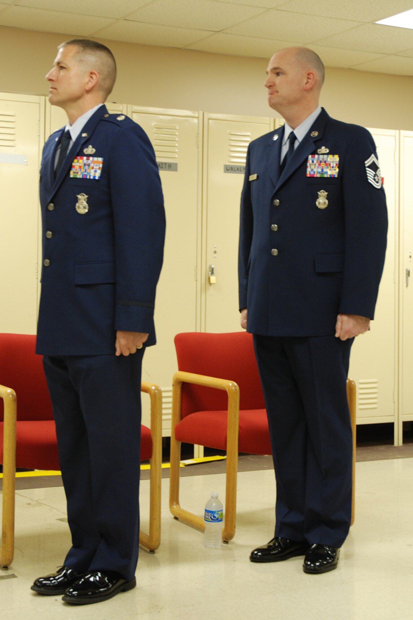 Lt. Col. Timothy Martz, 94th Security Forces Squadron commander, introduces Chief Master Sgt. DeMaine Milbach, 94 SFS manager, during a promotion and pin-on ceremony Feb. 4, at the base firing range. Milbach is succeeding Chief Master Sgt. Wendell Peacock, former 94 SFS manager and current 94th Airlift Wing Command Chief Master Sgt. (U.S. Air Force photo/Senior Airman Spencer Gallien)