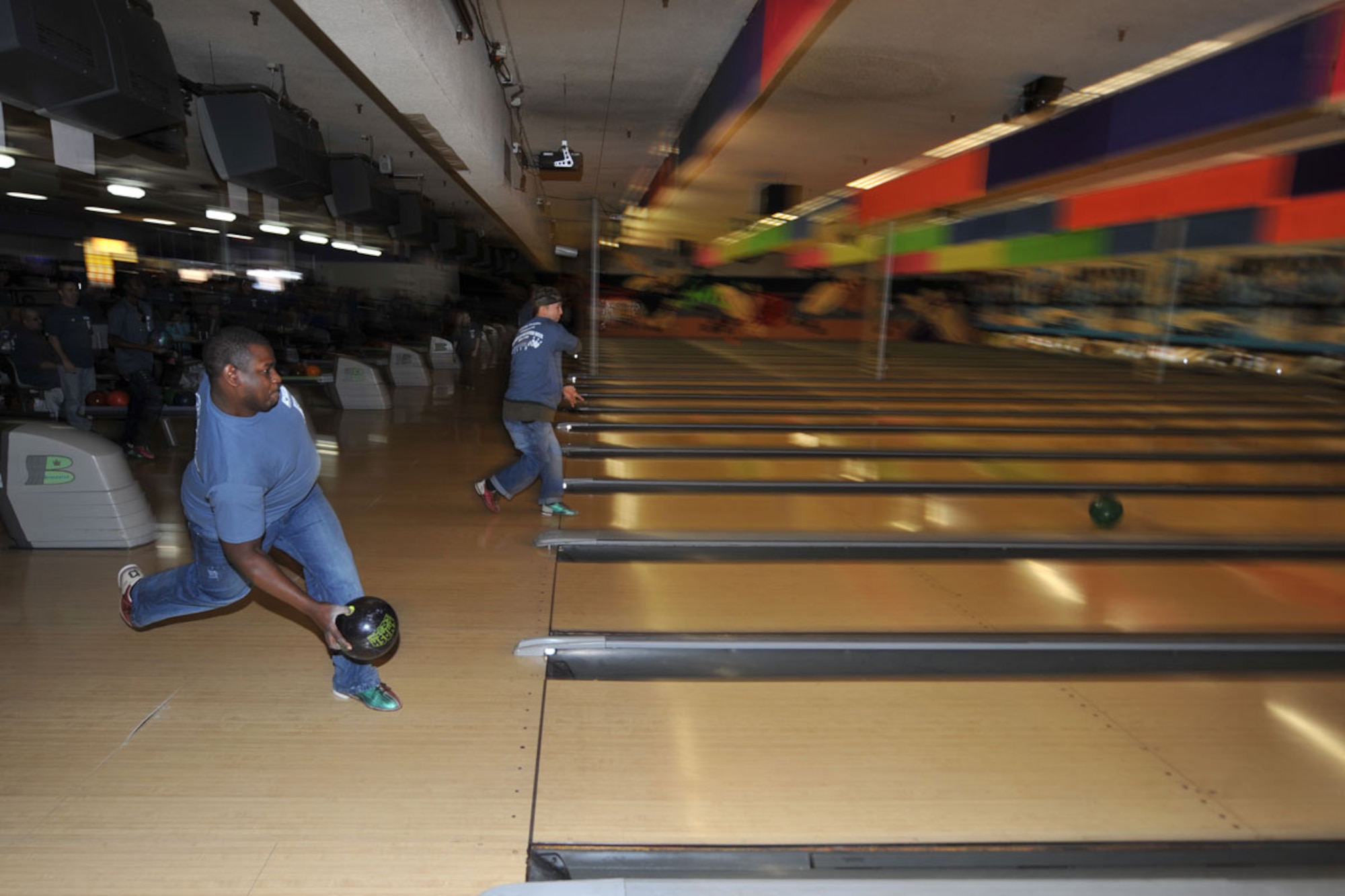 Army Sergeant Leandre Weaver of the 545th Military Police Company, and a native of La Porte, Texas, (left) bowls at this year’s annual Bowl-A-Thon at the Center Bowl in Anchorage Feb. 4. The Anchorage Chamber of Commerce sponsors events like this in appreciation to military services.(U.S. Air Force photo/ Airman 1st Class Ty-Rico Lea)