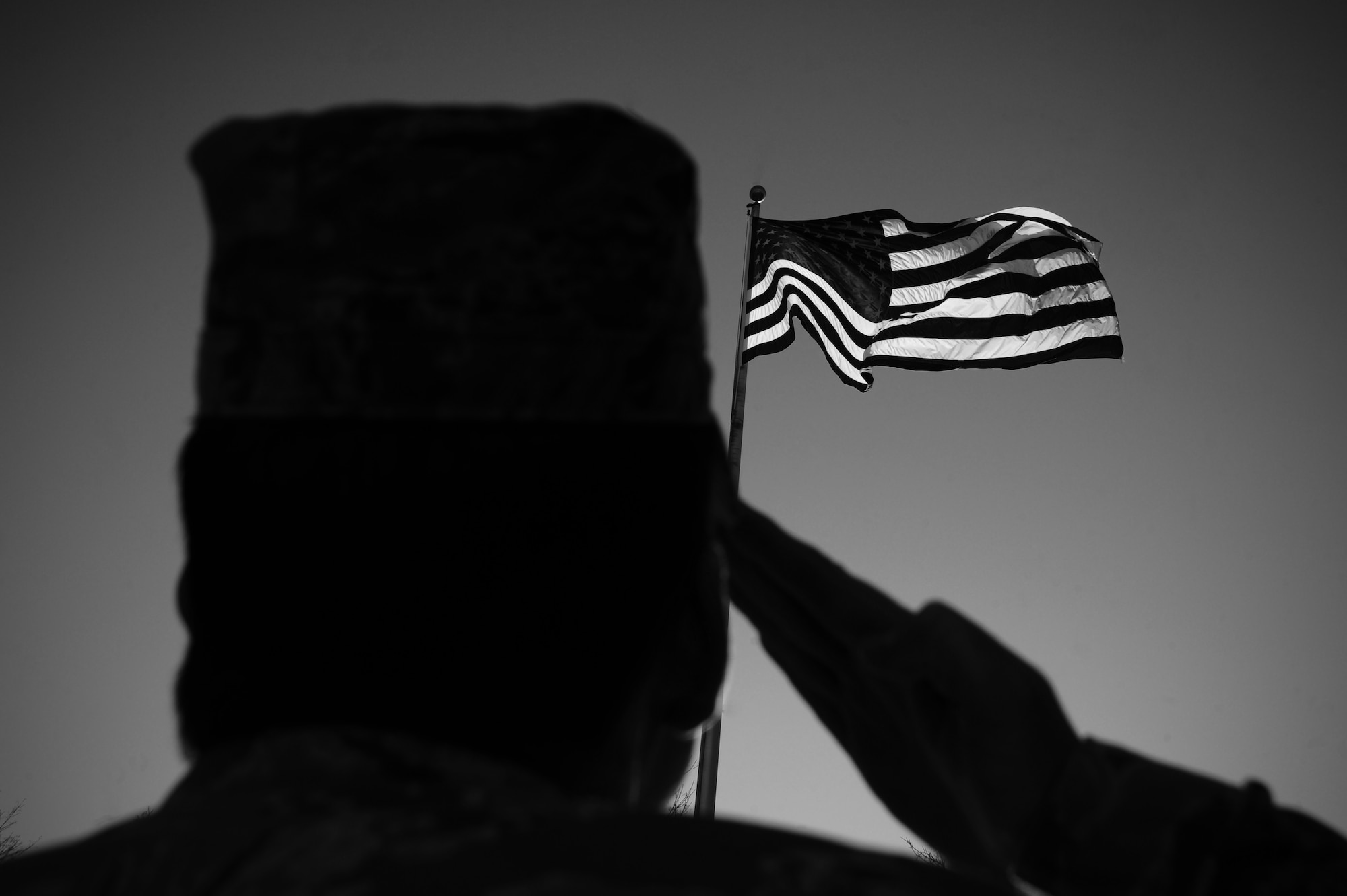 During mornings, “Reveille” signals the beginning of the duty day and is played at 6:30 a.m., Monday through Friday, followed by “To the Colors.”  “Retreat” signals the end of the duty day and is played at 5 p.m., Monday through Friday. Motorists should come to a complete stop upon hearing music during these times. (U.S. Air Force photo illustration by Airman 1st Class Taylor Curry)