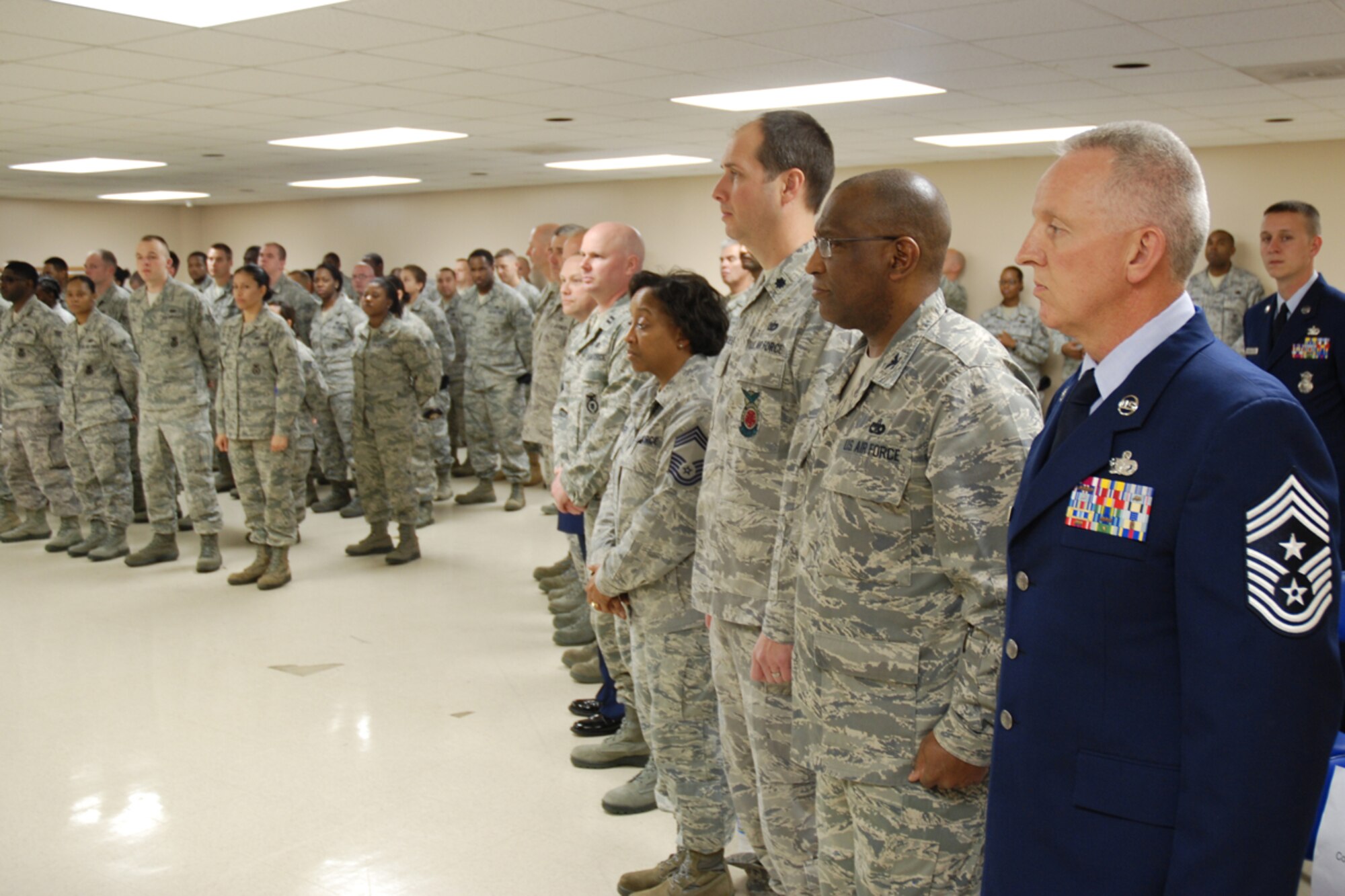 Chief Master Sgt. Wendell Peacock, 94th Airlift Wing Command Chief, Col. Marshall Irvin, commander, Lt. Col. Christopher Whitehead, deputy commander, Chief Master Sgt. Sandra Wright, superintendent, 94th Mission Support Group and members of the 94th Security Forces Squadron, attend Chief Master Sgt. DeMaine Milbach, 94 SFS manager's, promotion and pin-on ceremony Feb. 4, at the base firing range. Milbach is succeeding Chief Master Sgt. Wendell Peacock, former 94 SFS manager and current 94th Airlift Wing Command Chief Master Sgt. (U.S. Air Force photo/Senior Airman Spencer Gallien)