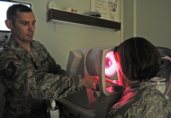 U.S. Air Force Tech. Sgt. Joel Ives performs a topographer test on U.S. Air Force Lt. Col. Holly Ellenberger during a refractive eye surgery prescreening at the 4th Aerospace Medicine Squadron optometry clinic on Seymour Johnson Air Force Base, N.C., Feb. 7, 2012. The test determines elevation of the corneas which gives the doctor performing the corrective surgery a layout of the patient’s eye. Ives, 4th AMDS ophthalmic technician, hails from Argyle, N.Y. Ellenberger, 4th AMDS dental flight commander, hails from Bexley, Ohio. (U.S. Air Force photo/Senior Airman Gino Reyes/Released)