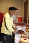 Master Sgt. Latonya Jones, Assignment Officer Sustainment and
Training superintendant, partakes in some of the delicacies at the Joint Base San Antonio-Randolph African American Heritage Committee 2nd Annual Soul Food Taste, at the JBSA-Randolph Community Center Feb, 3. 
(Courtesy photo)