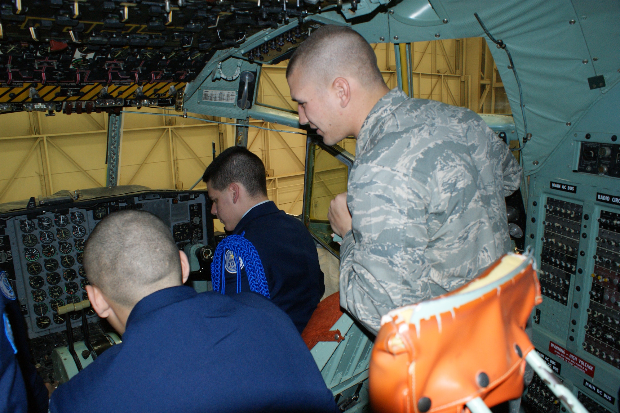 Cadets from the Wylie East High School Junior Reserve Officer Training Corps (JROTC ) sit in the cockpit of a C-130 during their tour Feb. 8, 2012. After a video presentation about the base and a welcome from a panel of active-duty Airmen, the 90 cadets and two tour buses visited both operational units and technical training destinations. (U.S. Air Force photo/Dan Hawkins)