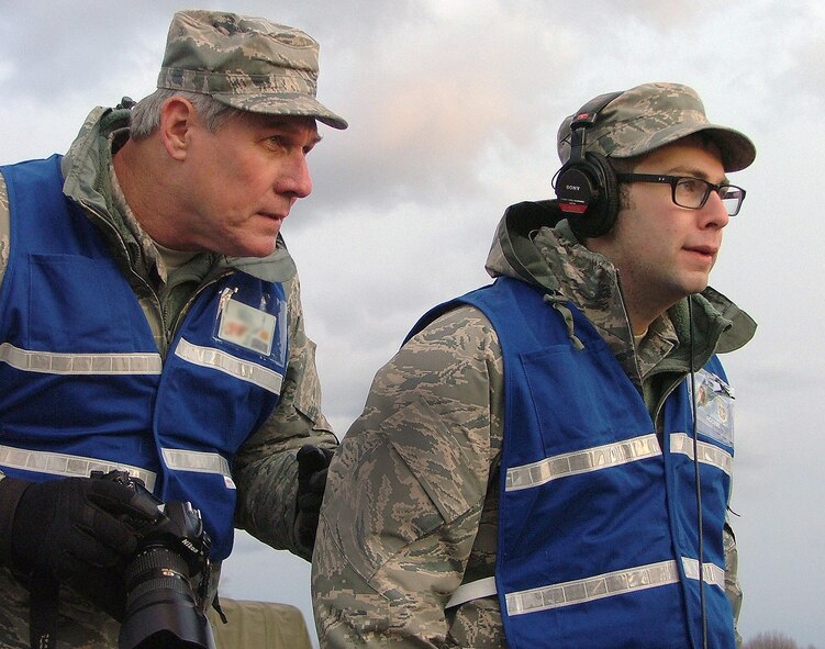 Master Sgt. Patrick Cashin and Senior Airman Thomas Grimes, 111th FW Public Affairs Office, capture end of the day activities and interviews during a recent Operational Readiness Inspection held Nov. 16-20, 2011 at Fort Indiantown Gap, Annville, Pa.