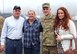 Tech. Sgt. Christopher Spencer, 270th Engineering Installation Squadron, awaits his departure time with his parents and wife Kristan here on Nov. 10, 2011.