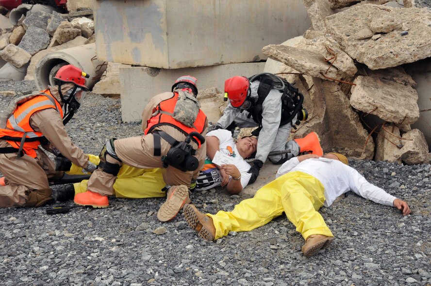 A search and extraction team recovers injured personnel at the incident site. Red Rose, a one week exercise held at Fort Indiantown Gap, Pa. Oct. 23-30, 2011, brought together over 570 Army and Air Guard members from all reaches of the state of Pennsylvania.