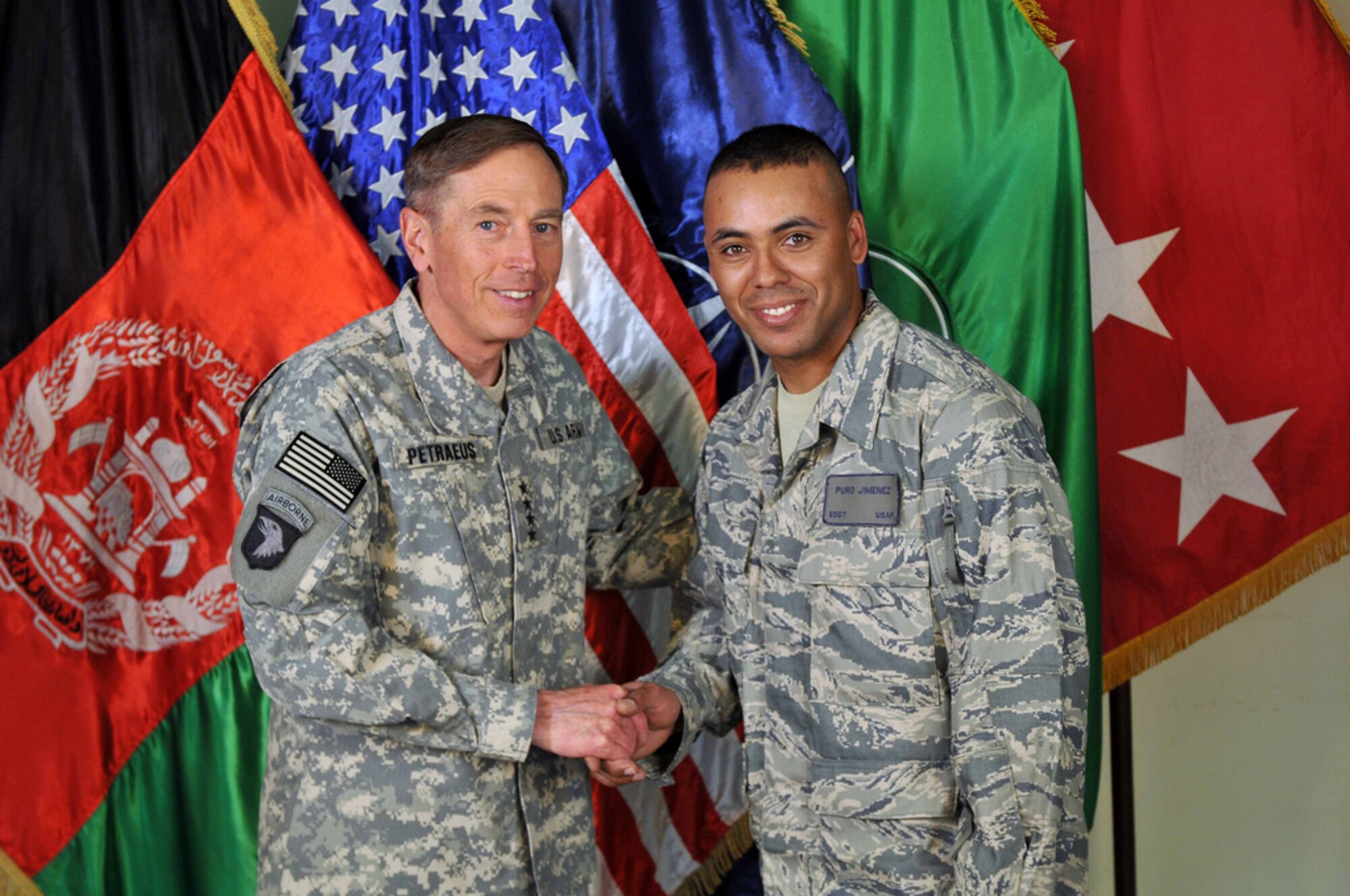 Staff Sgt. Puro Jimenez shakes hands with Gen. David Petraeus.