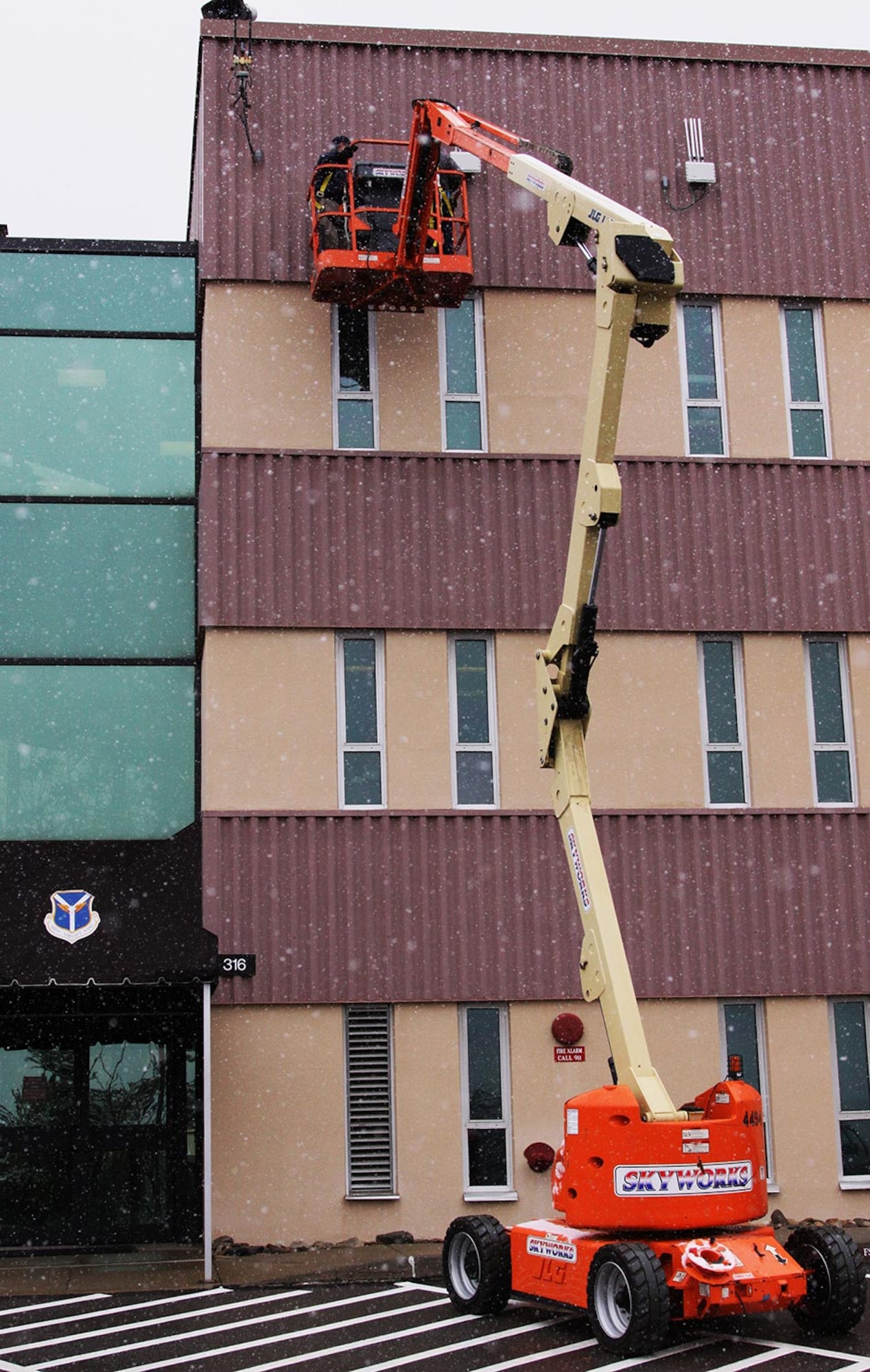 Civilian contractors from Fairfax, Va., troubleshoot the last installation procedures of the second generation encrypted wireless internet connection at the 911th Airlift Wing, Feb. 8, 2012. These networks provide secure networking architectures and solutions to the base which enable collaboration and connectivity in order to increase efficiency, reduce costs, and improve mission outcomes. (U.S. Air Force photo by Tech. Sgt. Ralph Van Houtem/Released)