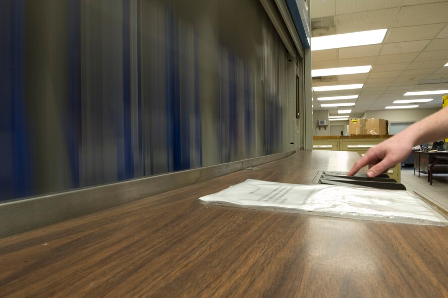Senior Airman Josh Porter, 2nd Maintenance Squadron Aerospace Ground Equipment Flight, searches the hardware shelf on Barksdale Air Force Base, La., Feb. 7. When AGE Airmen need specific pieces of hardware, Porter retrieves the items for them. Each piece of hardware is numbered and placed on a shelf making it easier to find. (U.S. Air Force photo/Airman 1st Class Benjamin Gonsier)(RELEASED)