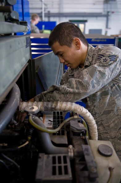 Senior Airman Nevin Noceda, 2nd Maintenance Squadron Aerospace Ground Equipment Flight, inspects an engine on Barksdale Air Force Base, La., Feb. 7. Airmen in the AGE flight maintain ground equipment to keep aircraft operational. (U.S. Air Force photo/Airman 1st Class Benjamin Gonsier)(RELEASED)