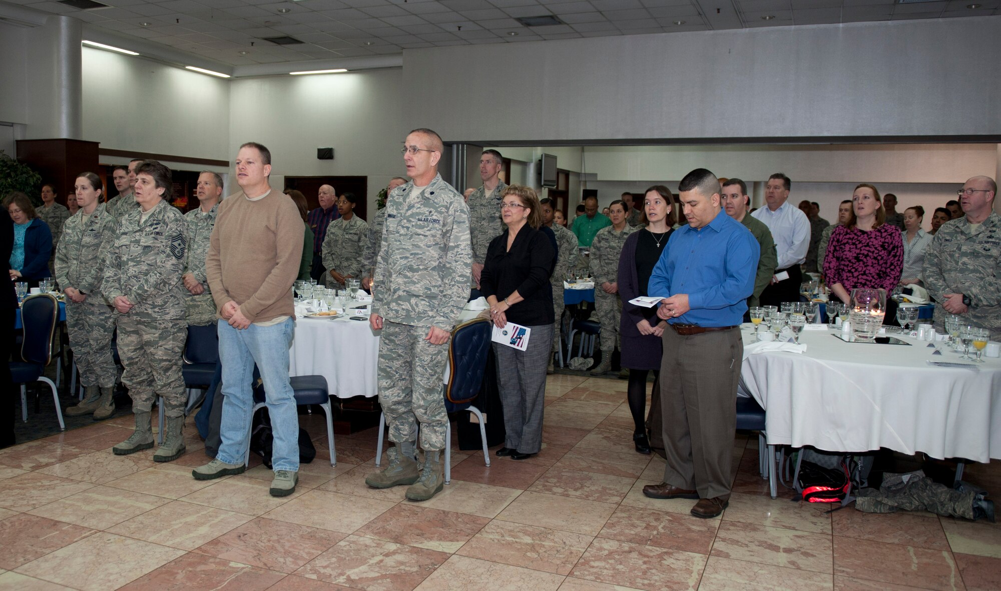 Members of Team Incirlik sing "God Bless America," during the 2012 National Prayer Breakfast Feb. 8, 2012, at Incirlik Air Base, Turkey. The annual event is held in conjunction with the National Prayer Breakfast in Washington, D.C. U.S. Air Forces in Europe Command Chaplain Col. G. Scott Henry attended to share words of wisdom as well as to encourage Airmen to be resilient to things that test their faith and to take care of each other. (U.S. Air Force photo by Senior Airman Anthony Sanchelli/Released)
