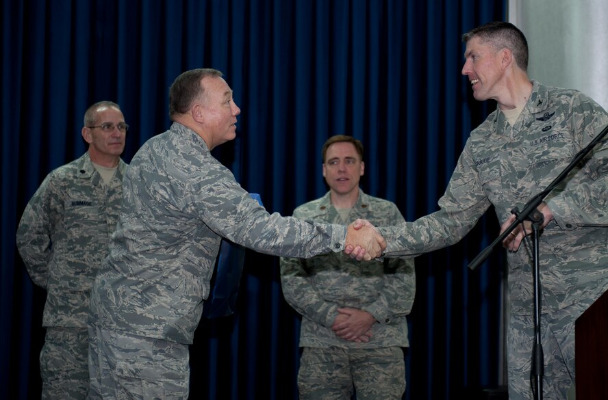 Chaplain (Col.) Scott Henry, U.S. Air Forces in Europe command chaplain, left, shakes hands with Col. Chris Craige, 39th Air Base Wing commander, during the 2012 National Prayer Breakfast Feb. 8, 2012, at Incirlik Air Base, Turkey. The annual event is held in conjunction with the National Prayer Breakfast in Washington, D.C. Henry attended to share words of wisdom as well as to encourage Airmen to be resilient to things that test their faith and to take care of each other. (U.S. Air Force photo by Senior Airman Anthony Sanchelli/Released)
