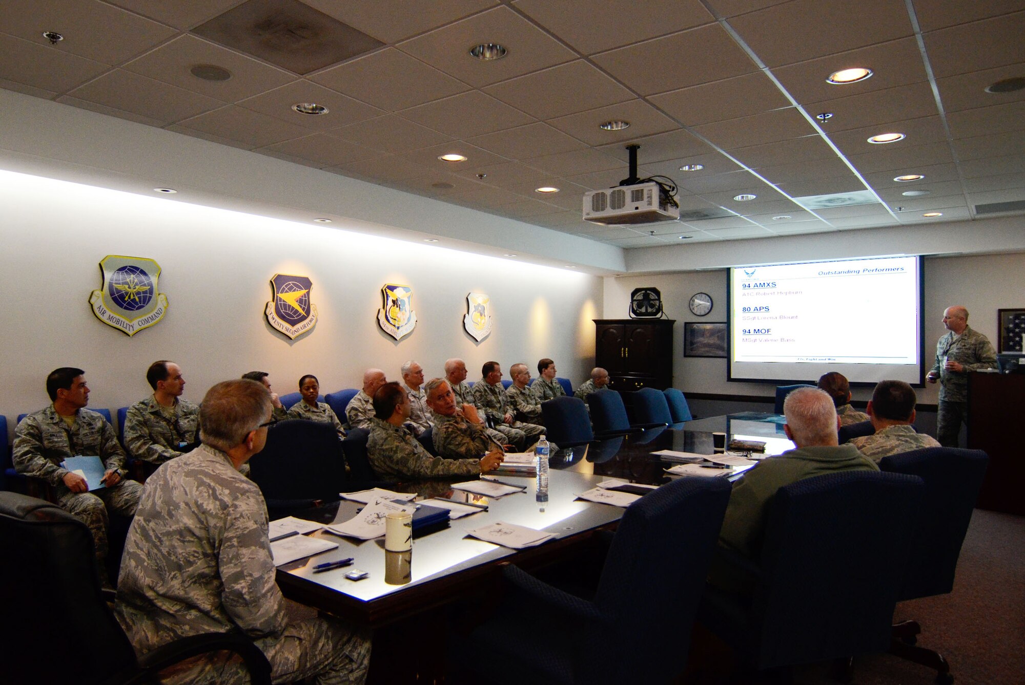 Col. Larry Stephenson, Air Force Reserve Command Logistics Compliance Assessment Program (LCAP) team chief, presents inspection results to Col. Tim Tarchick, 94th Airlift Wing commander and staff during an out-brief Feb. 7. The 94 AW scored an overall satisfactory. (U.S. Air Force photo/Don Peek)