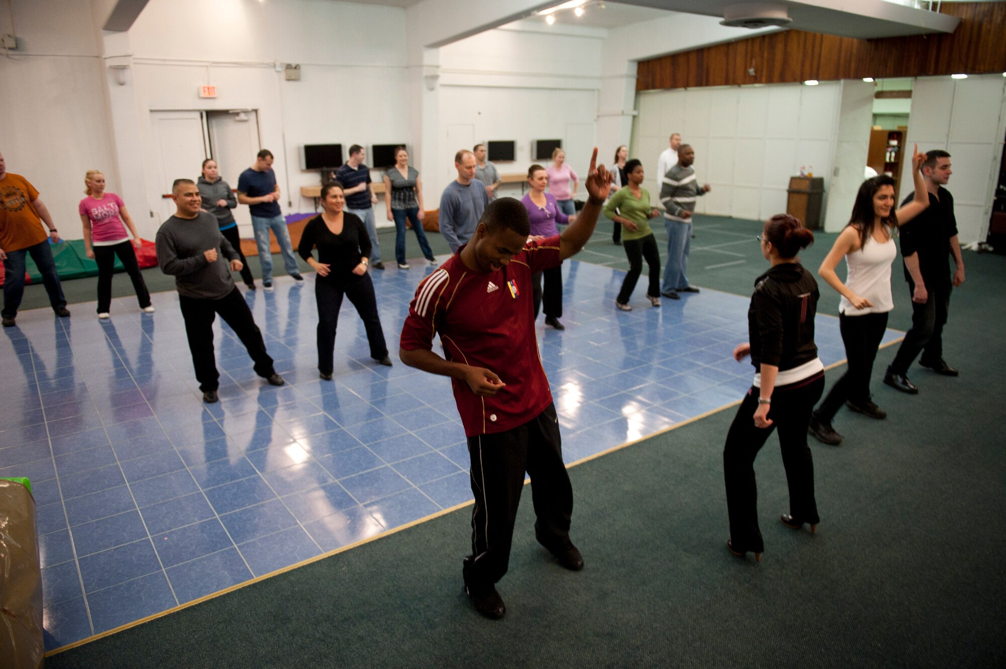 Couples learn to dance Feb. 8, 2012, at the community center at Incirlik Air Base, Turkey. The 39th Force Support Squadron offered the Couples Dance Workshop for participants to learn several basic salsa dance steps. (U.S. Air Force photo by Tech. Sgt. Michael B. Keller/Released)