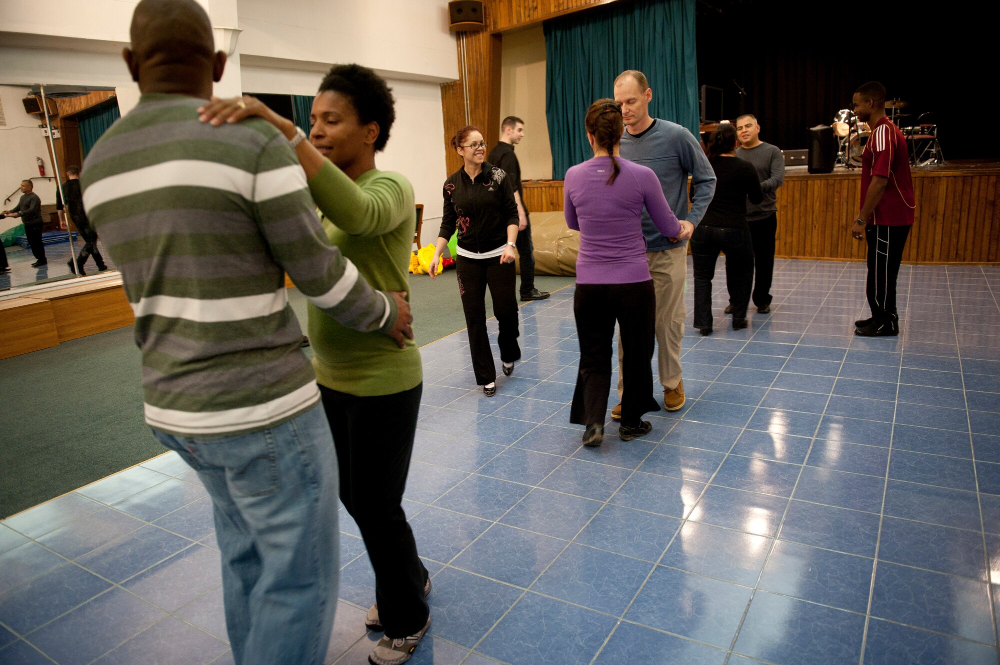 Couples learn to dance Feb. 8, 2012, at the community center at Incirlik Air Base, Turkey. The 39th Force Support Squadron offered the Couples Dance Workshop for participants to learn several basic salsa dance steps. (U.S. Air Force photo by Tech. Sgt. Michael B. Keller/Released)