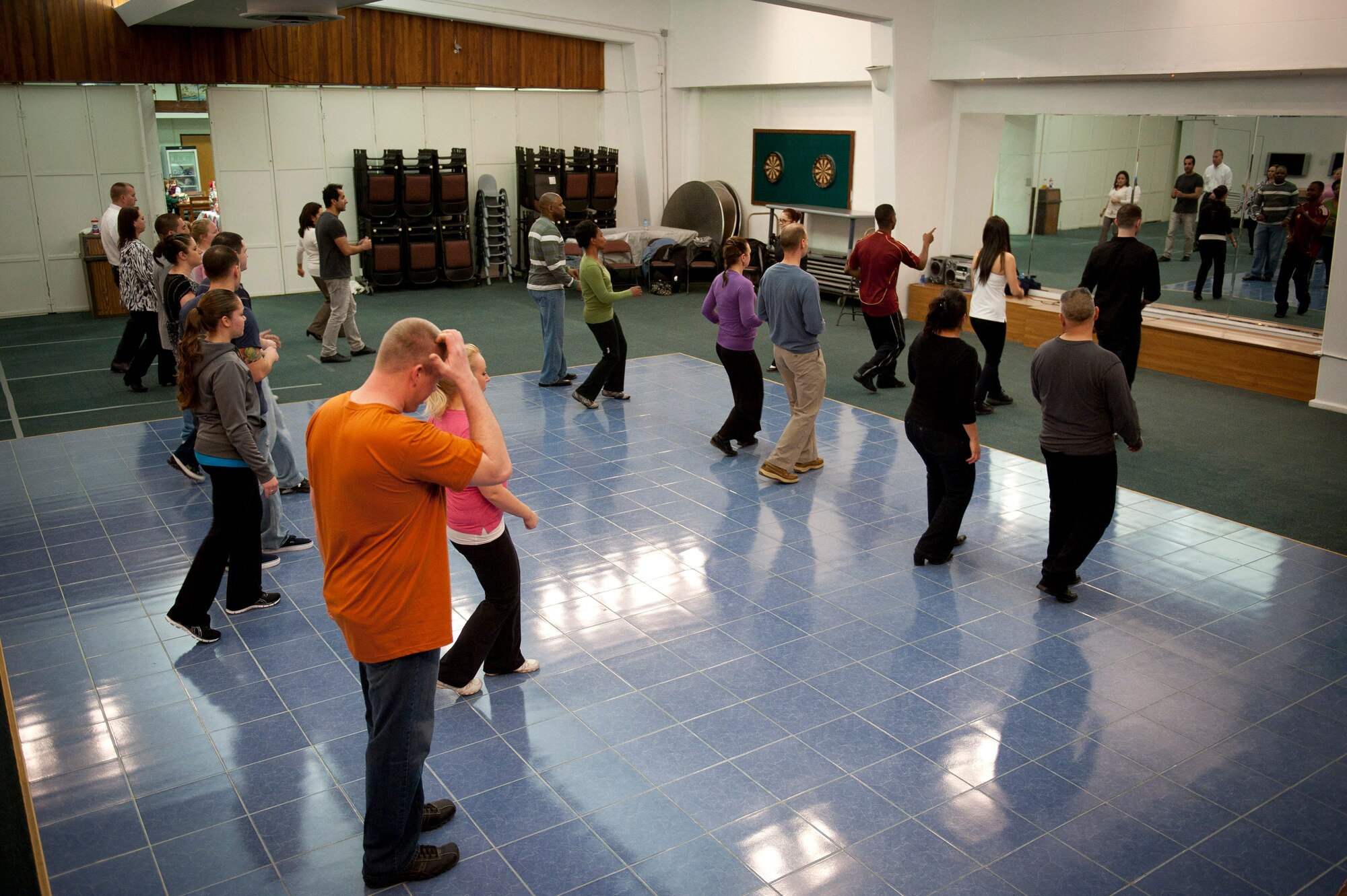 Couples learn to dance Feb. 8, 2012, at the community center at Incirlik Air Base, Turkey. The 39th Force Support Squadron offered the Couples Dance Workshop for participants to learn several basic salsa dance steps. (U.S. Air Force photo by Tech. Sgt. Michael B. Keller/Released)
