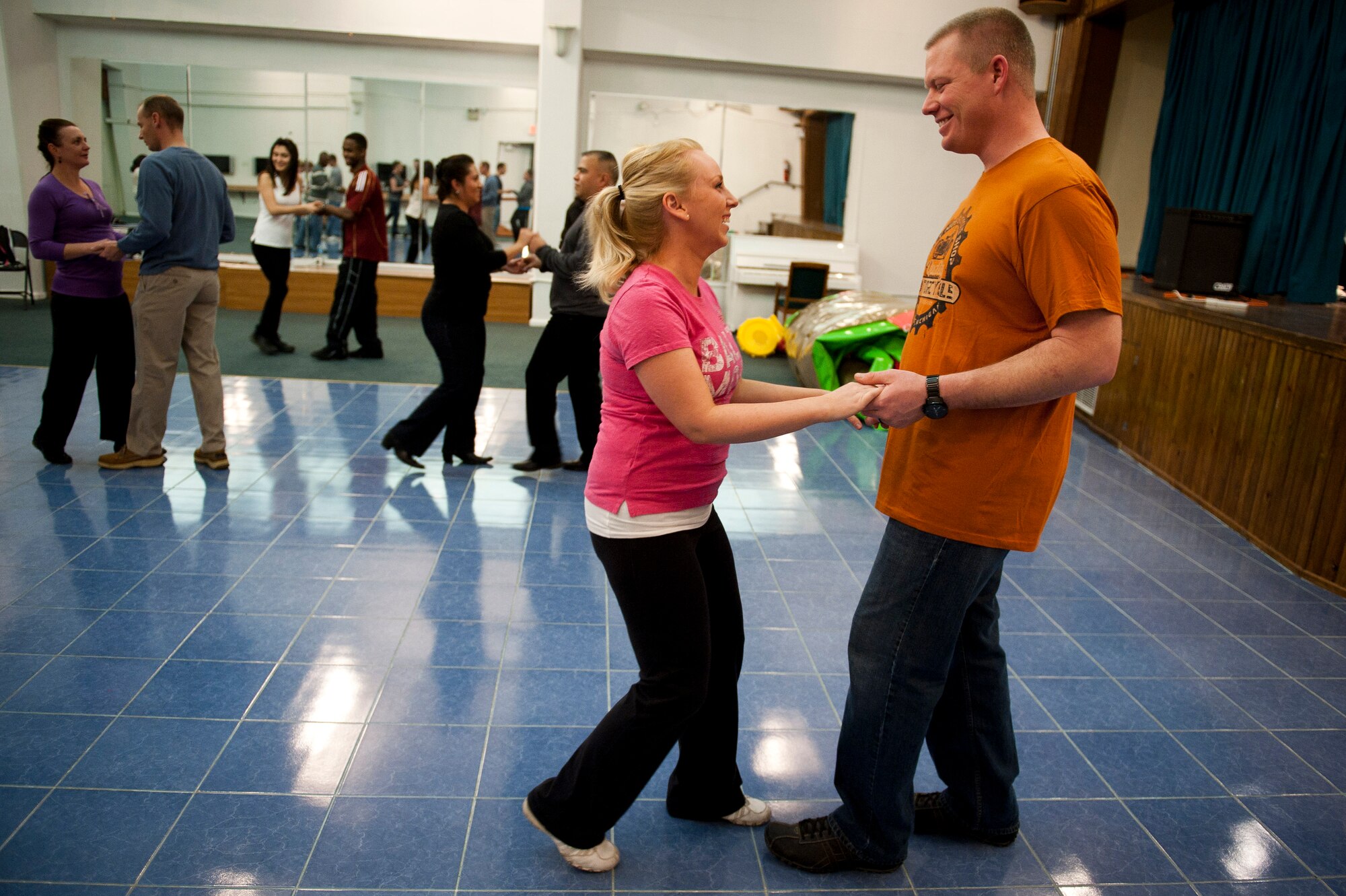 Tech. Sgt. Brooks Hansen, 728th Air Mobility Squadron, and his wife, Meghan Hansen learn how to dance Feb. 8, 2012, at the community center at Incirlik Air Base, Turkey. The 39th Force Support Squadron offered the Couples Dance Workshop for participants to learn several basic salsa dance steps. (U.S. Air Force photo by Tech. Sgt. Michael B. Keller/Released)