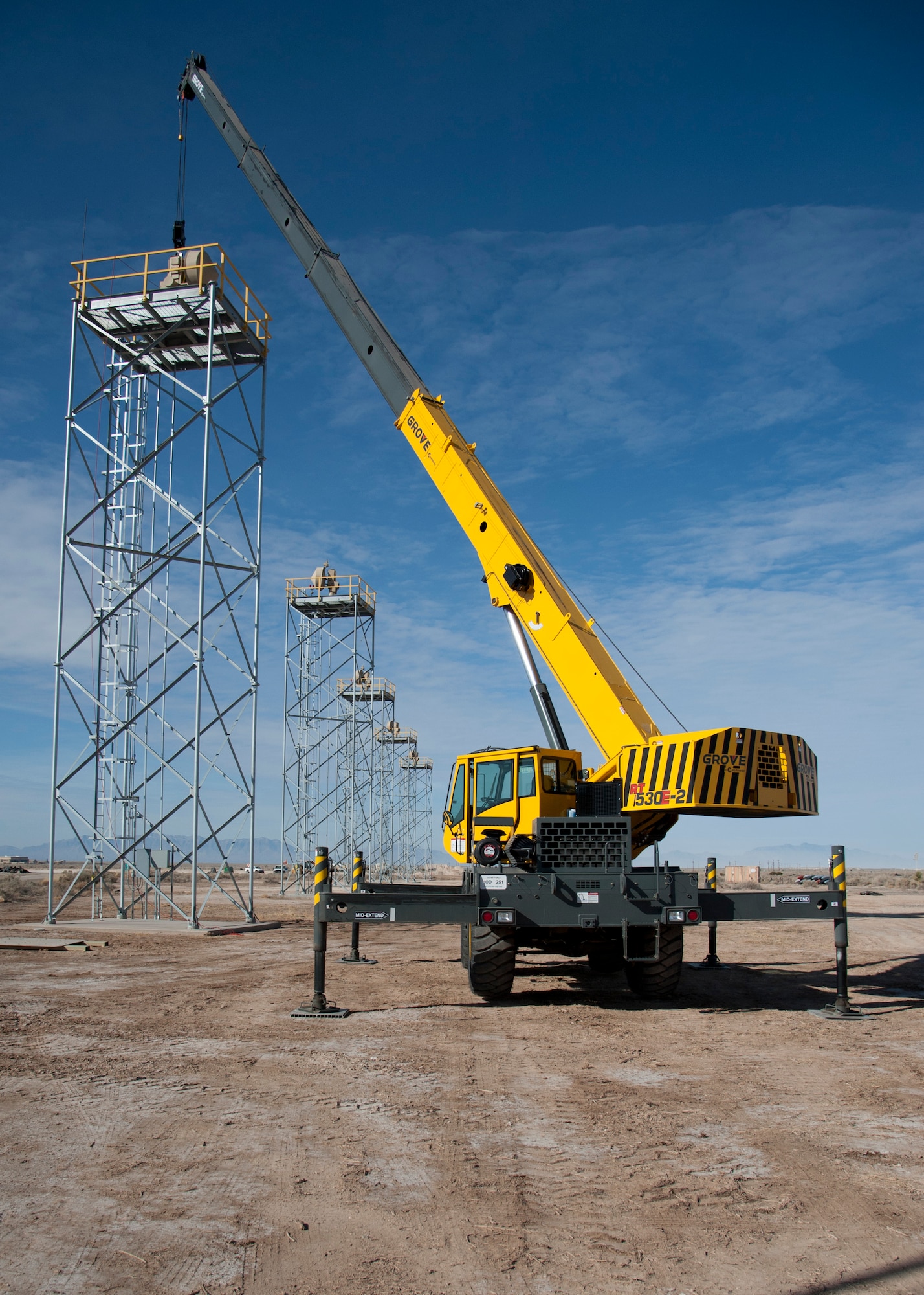 HOLLOMAN AIR FORCE BASE, N.M. -- A ground data terminal sits on tower after being lifted by a crane, Feb. 7. This particular GDT is an upgraded unit that features fiber optic antennas that cut potential signal lag by as much as three to four seconds compared to the older GDT models that have copper wiring. (U.S. Air Force photo by Airman 1st Class Siuta B. Ika/ Released)