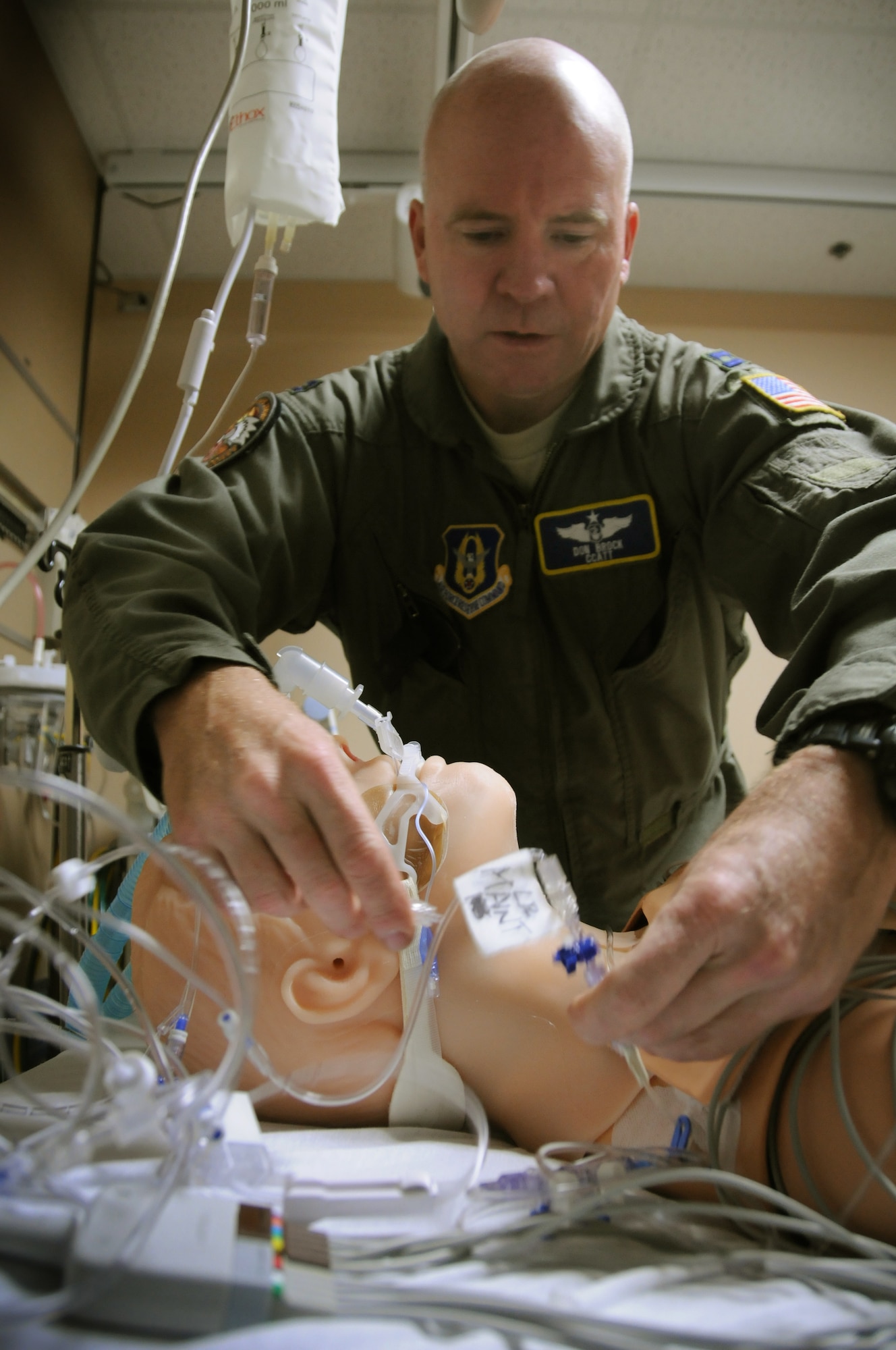 Capt. Don Brock, trauma nurse specialist, readies HAL, an animatronic manikin that can imitate a wide variety of medical issues at the Minneapolis VA Medical Center before a Critical Care Air Transport Team exercise February 4. (Air Force Photo/Tech. Sgt Bob Sommer)