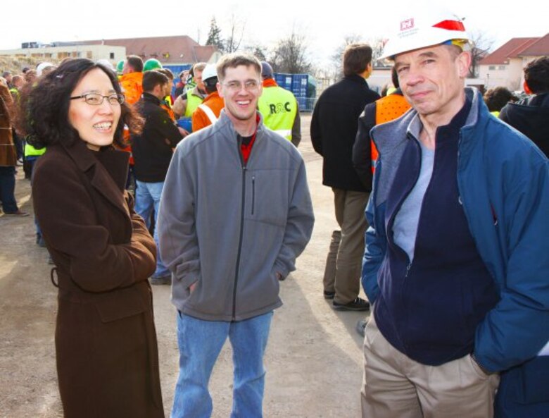 WIESBADEN, Germany — Members of the U.S. Army Corps of Engineers Europe District project delivery team, including, Daniella Yi, Ryan Moore and George VanCook pause during the Richtfest, or "topping off" ceremony, to celebrate the completion of the exterior structure of the mission command center. The Richtfest celebrated an important construction milestone and provided a forum to recognize all the partners involved in the construction of the MCC.