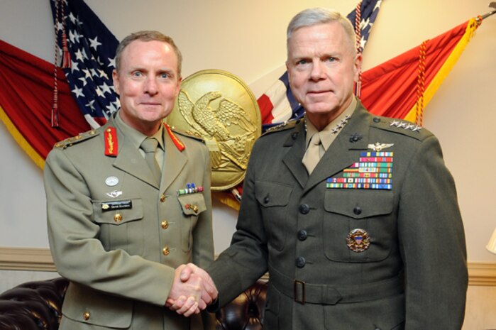 Afghan National Army Lance Cpl. Shamsodun, automatic rifleman, 3rd Tolai, 2nd Kandak, 2nd Brigade, 215th Corps, a 20-year-old native of Kunduz Province, sets up a machine gun position during a security patrol here, Feb. 9. U.S. Marines recently transferred authority of a local patrol base, Hanjar Yak, to the ANA. Afghan soldiers provide security for the local area by conducting patrols and maintaining positive relations with local villagers.