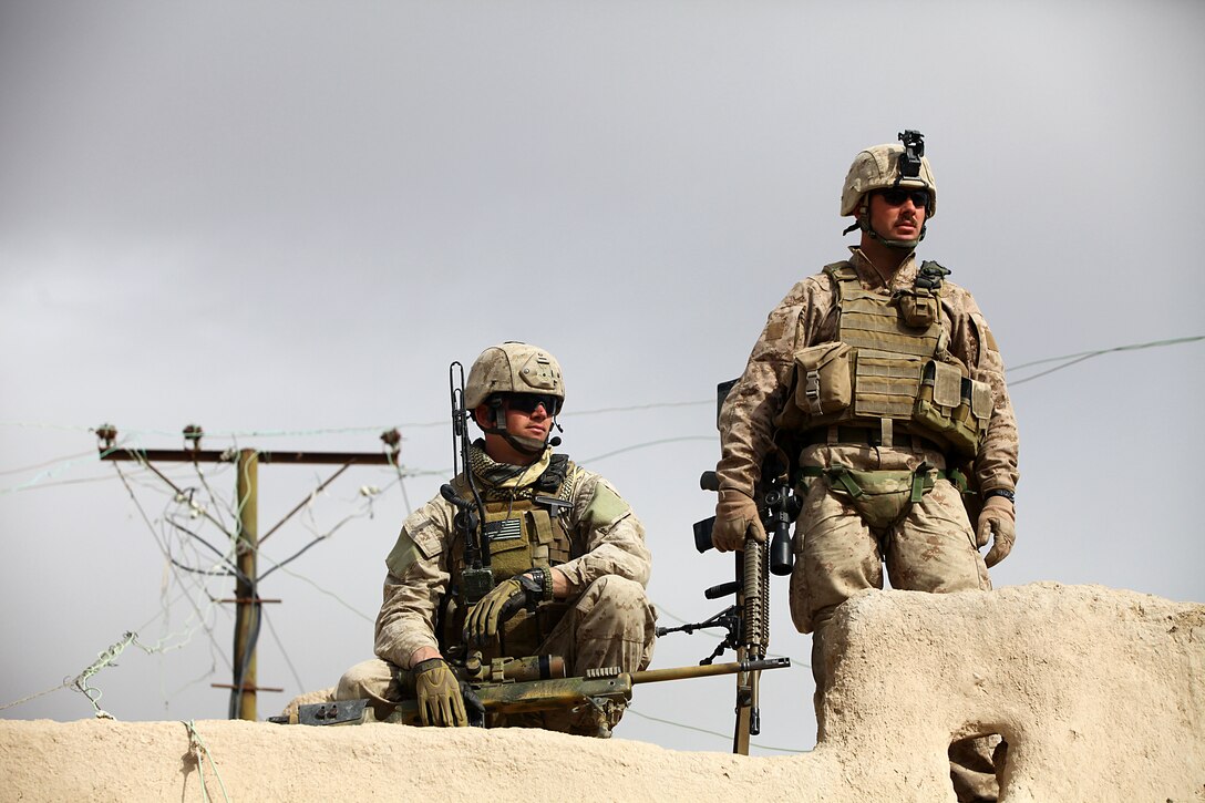 A sniper team with 2nd Battalion, 4th Marines prepares to provide cover and overwatch during Operation Alekhine’s Gun, a heliborne and motorized raid into an area known for corruption and enemy occupation. Marines made use of their mobilized speed and night vision capability to disrupt and confuse enemy operations in the city of Shah Karez.