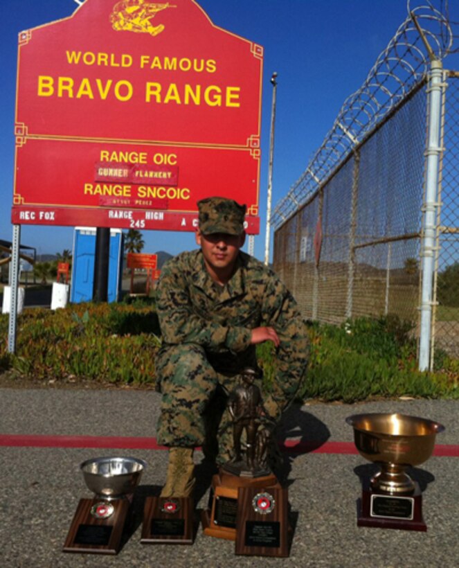 Sgt. Joseph Orozco, a canvassing recruiter with Recruiting Substation Tempe, Recruiting Station Phoenix, proudly displays the numerous trophies he and his team from the 8th Marine Corps District won at the Depot Competition-in-Arms Program shooting match held at Marine Corps Base Camp Pendleton, Calif., Jan. 30 – Feb. 10, 2012.  Orozco’s individual efforts earned him the Sergeant Gabriel Otero, Jr. Trophy for attaining the highest two-day match aggregate score during the 300-yard line rapid fire stage of the competition.