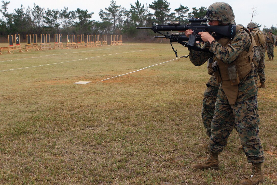 Marines and sailors with Headquarters Battery, 12th Marine Regiment, engage targets at close distances during the combat marksmanship Program shoot on Range 18 at Camp Hansen Feb. 10. The regiment is part of 3rd Marine Division, III Marine Expeditionary Force.