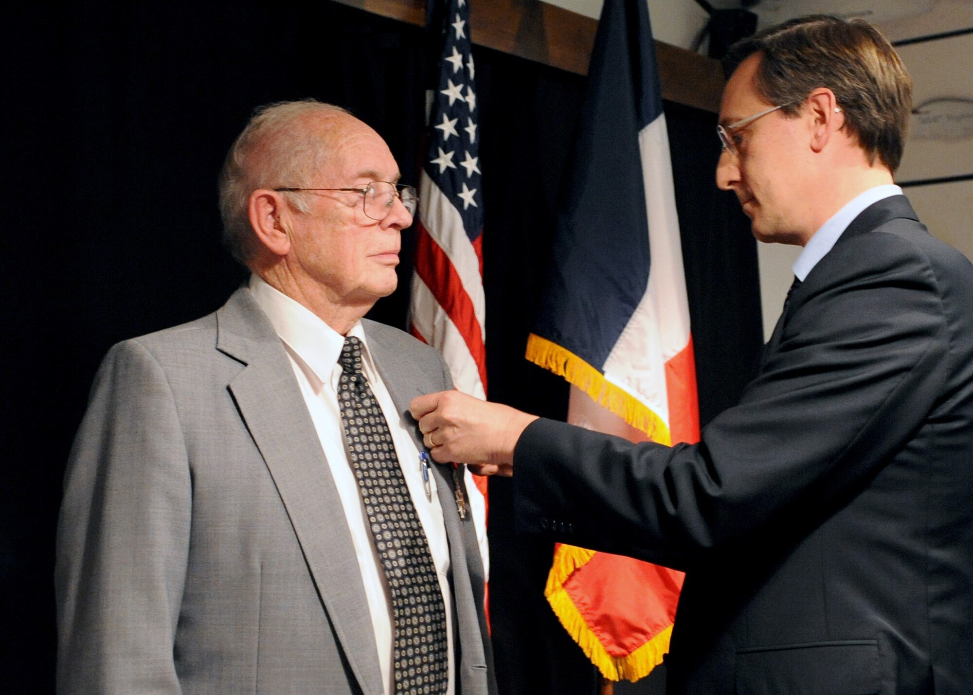 Monsieur Jean-Claude Brunet, consul general of France in New Orleans, La., pins the National Order of the Legion of Honor medal to World War II veteran Mr. William V. Hines during a ceremony at Barksdale Air Force Base, La., Feb. 10. The honor, France's highest distinction, was established by Napoleon Bonaparte in 1802. Recipients are approved by French President Nicolas Sarkozy. (U.S. Air Force photo/Senior Airman La'Shanette V. Garrett)(RELEASED)