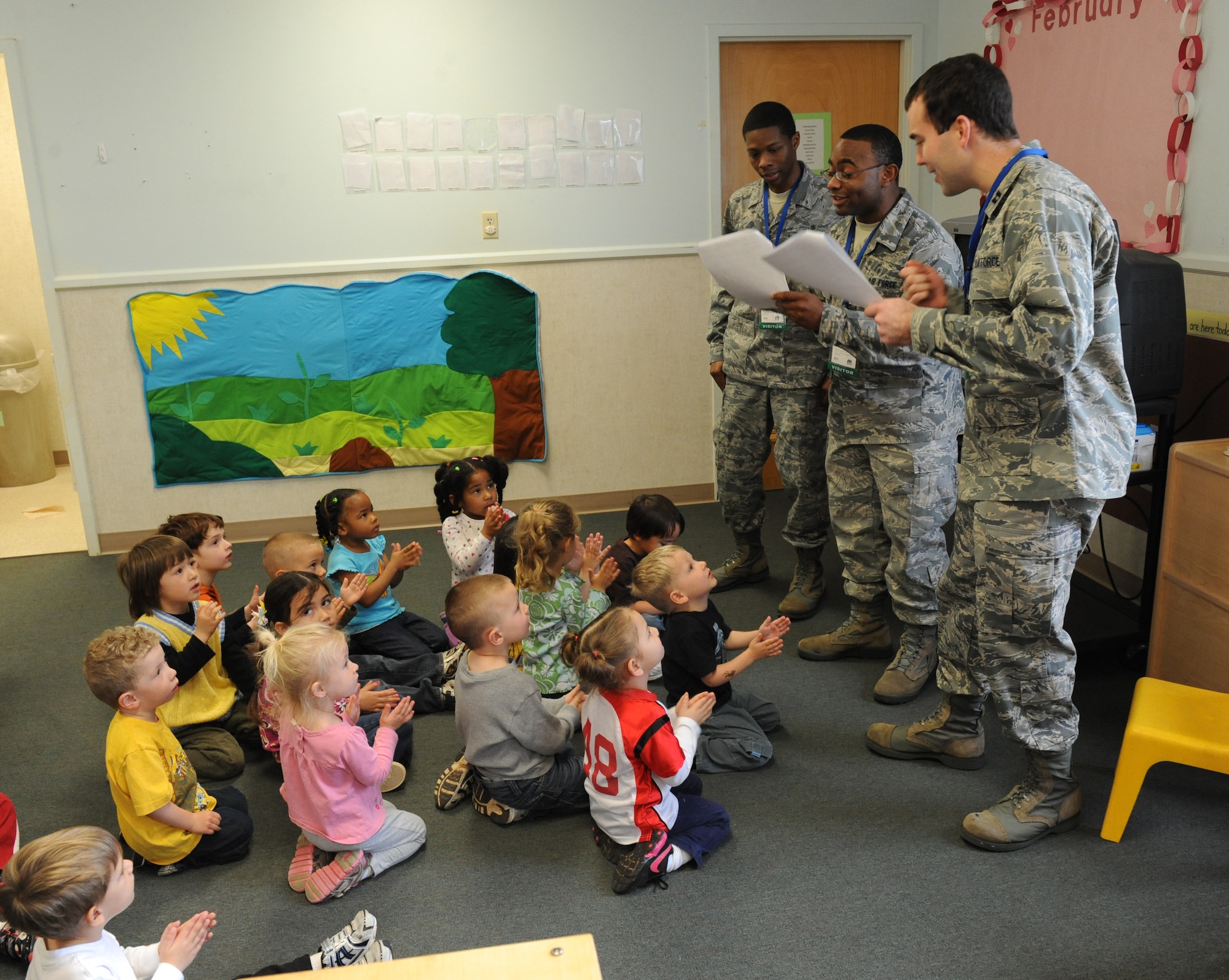 Airmen from the 2nd Dental Squadron sing a song about dental hygiene to children from the Child Development Center at Barksdale Air Force Base, La., Feb. 7. The children were shown videos and demonstrations on how to properly brush and clean their teeth. (U.S. Air Force photo/Airman 1st Class Micaiah Anthony)(RELEASED)
