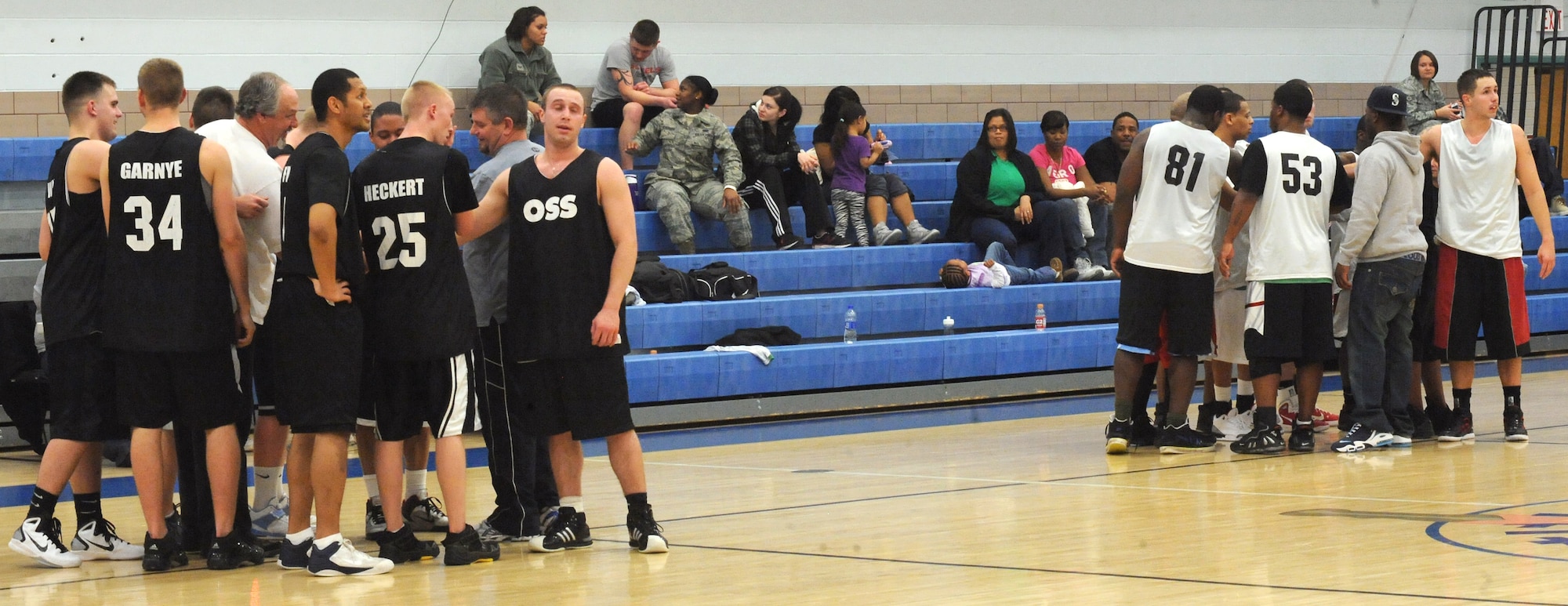 The 319th Operations Support Squadron and 319th Security Forces Squadron prepare themselves for the second half of the base intramural basketball championship game at the Fitness Center on Grand Forks Air Force Base, N.D., Feb. 8, 2012.  The Security Forces team finished the season with a 6-1 record, defeating the 319th Operations Support Squadron 49-43 in the championship game.  (U.S. Air Force photo by Airman 1st Class Xavier Navarro)
