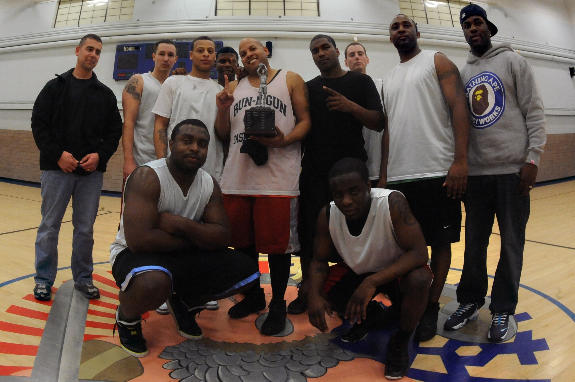 The 319th Security Forces basketball team poses for a photo after winning the base intramural basketball championship game at the Fitness Center on Grand Forks Air Force Base, N.D., Feb. 8, 2012.  The Security Forces team finished the season with a 6-1 record, defeating the 319th Operations Support Squadron 49-43 in the championship game.  (U.S. Air Force photo by Airman 1st Class Xavier Navarro)
