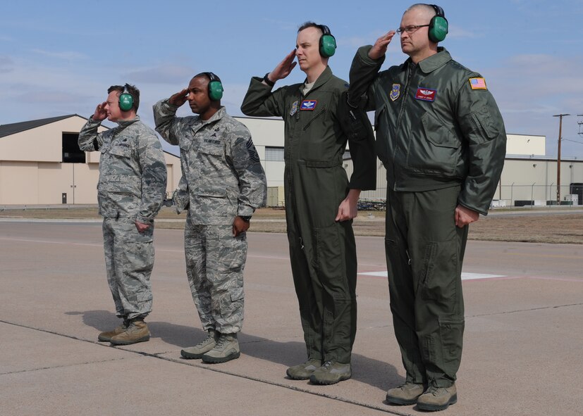 Members from the 7th Bomb Wing render a salute as Maj. Gen. Frederick H. Martin, Air Mobility Command director of operations, taxis in a new J-model Feb. 9, 2012, at Dyess Air Force Base, Texas. The aircraft is 14th of 28 J-models to be delivered to Dyess by 2013 and the first for the 39th Airlift Squadron. (U.S. Air Force photo by Airman 1st Class Peter Thompson/Released)