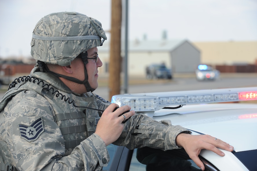 U.S. Air Force Staff Sgt. Jonathan Schnaible, 7th Security Forces, awaits further instructions from headquarters during an active shooter exercise Feb. 9, 2012, at Dyess Air Force Base, Texas. The scenario involved a disgruntled airman targeting coworkers. (U.S. Air Force photo by Tech. Sgt. Ryan Kruse/Released)