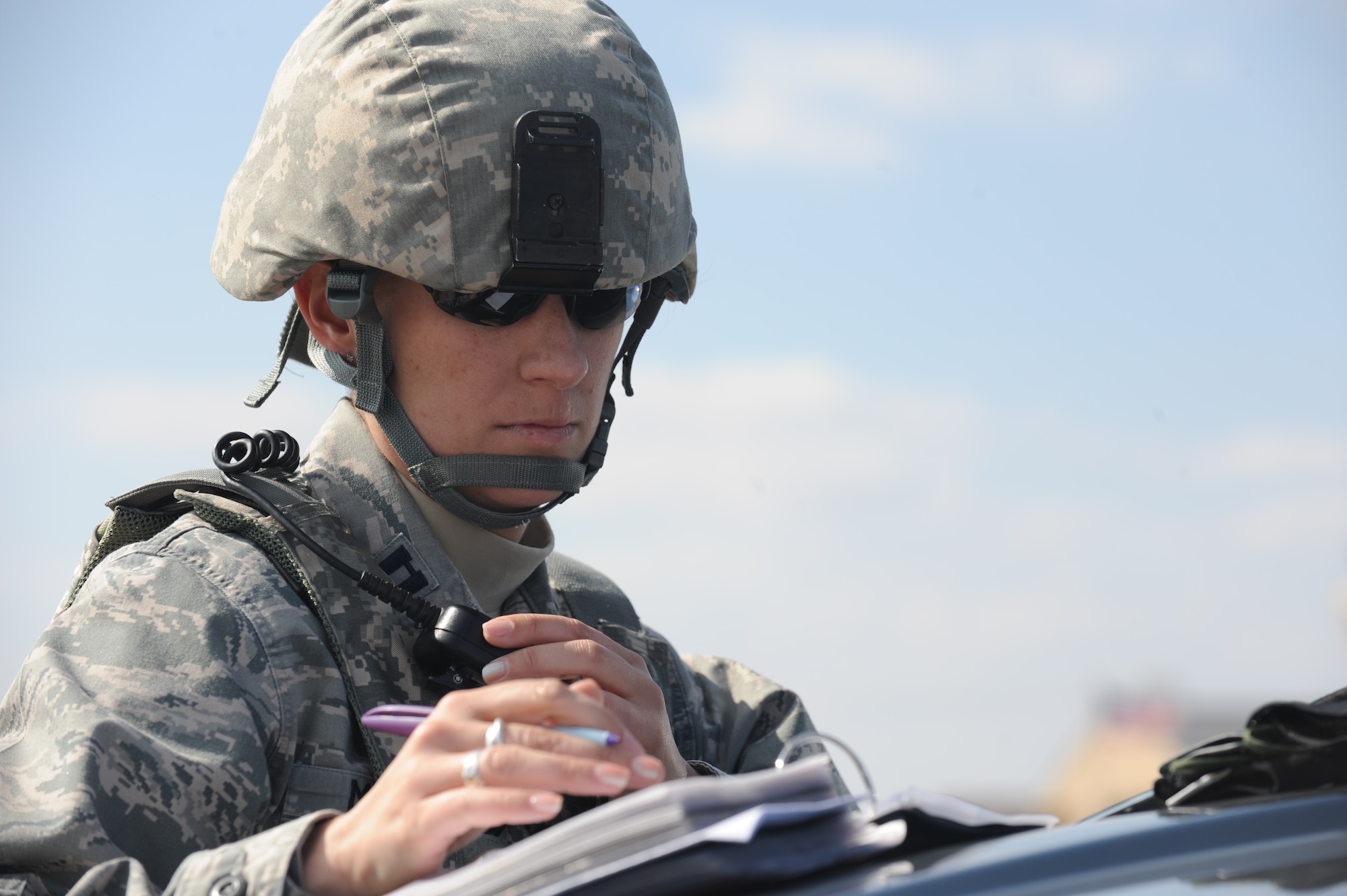 U.S. Air Force Capt. Alisha Mason, 7th Security Forces operations officer, reviews her notes during an active shooter exercise Feb. 9, 2012, at Dyess Air Force Base, Texas. Mason was the on-scene commander during the training scenario. (U.S. Air Force photo by Tech. Sgt.  Ryan Kruse/Released)