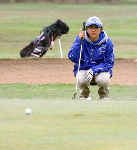 LAUGHLIN AIR FORCE BASE, Texas – A competitor eyes her putt before tapping it in at the Del Rio High School Brown Automotive Girls Invitational Golf Tournament held at the Leaning Pine Golf Course here Feb. 10. Thirty-six golfers from eight schools competed in the tournament. (U.S. Air Force photo/Airman 1st Class Nathan L. Maysonet)